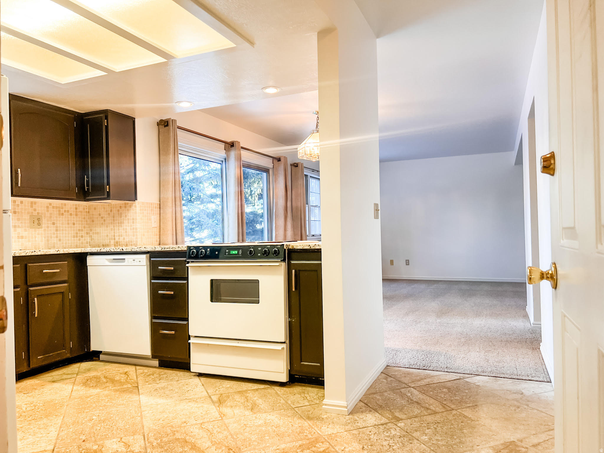 Opportunity knocks in the heart of Midway! This 2-bedroom, 2-bath main-floor condo offers a functional layout with no stairs and easy access for everyday living. Ideal for buyers looking to build equity or investors seeking a value-add project, the home provides a solid starting point with quartz kitchen countertops and a tile backsplash already in place. With a little vision and updating, this unit has the potential to shine as a full-time residence, weekend retreat, or rental.  Step out from your living room onto your peaceful patio and enjoy a summer BBQ while taking in peaceful views of the valley. A detached one-car garage provides convenient parking and extra storage, and the location offers easy access to Midway's charming Main Street, golf, parks, and year-round outdoor recreation. Whether you're entering the market, downsizing, or adding to your investment portfolio, this is a rare chance to purchase in a desirable community and make it your own.  Community amenities include a fitness center, clubhouse with game room, sauna/steam room, racquetball court, tennis and pickleball courts, picnic areas, and playground. Square footage figures are provided as a courtesy estimate only and were obtained from independent measurement. Buyer is advised to verify all.