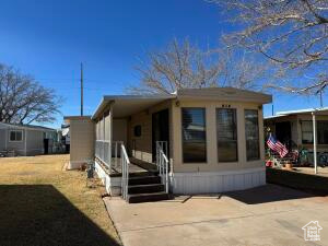 Charming 2-Bedroom Park Model in Sunny Southern Utah! This 2-bedroom, 1-bath home sits on an extra-large 0.09-acre lot with lots of windows and new blinds for natural light and privacy. New washer & dryer are being installed. Enjoy the covered back patio with a connected shed and a welcoming front porch. Located in a fun, active community with great amenities. Just added new stack washer/dryer. Don't miss this perfect getaway or full-time home-schedule your showing today! Buyer to verify all information.  Listing agent has a few staging items that will not be included in the sell.