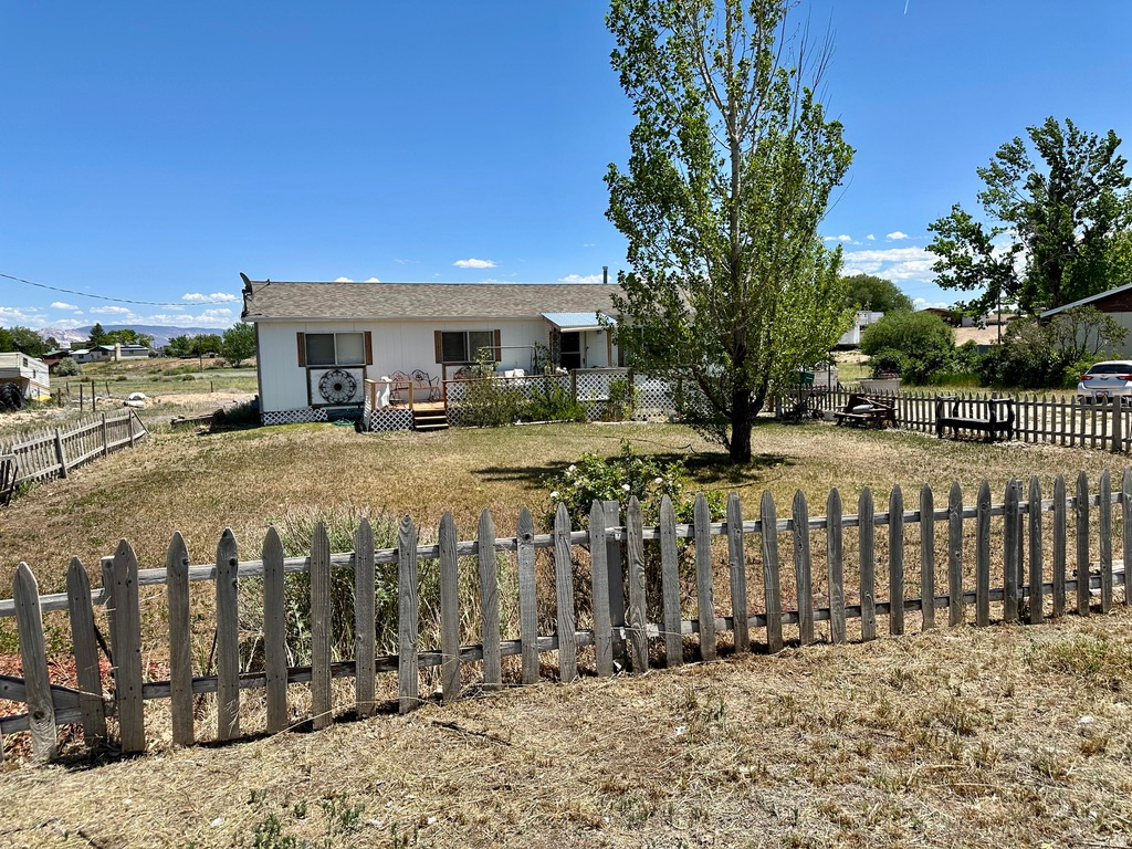 Charming Country Home with Stunning Views! Welcome home to this adorable 3-bedroom, 1-bath rambler nestled in a peaceful country setting. Featuring durable and stylish LVP flooring throughout, this inviting home offers comfortable single-level living with plenty of space to enjoy. Step outside and take in the gorgeous views, with an open field stretching behind the property for added privacy. The expansive lot provides endless possibilities for gardening, recreation, or simply enjoying the outdoors. Additional features include a convenient carport, ample RV parking, and plenty of room for all your vehicles, toys, and hobbies. If you're looking for country charm, open space, and beautiful scenery, this property is a must-see!