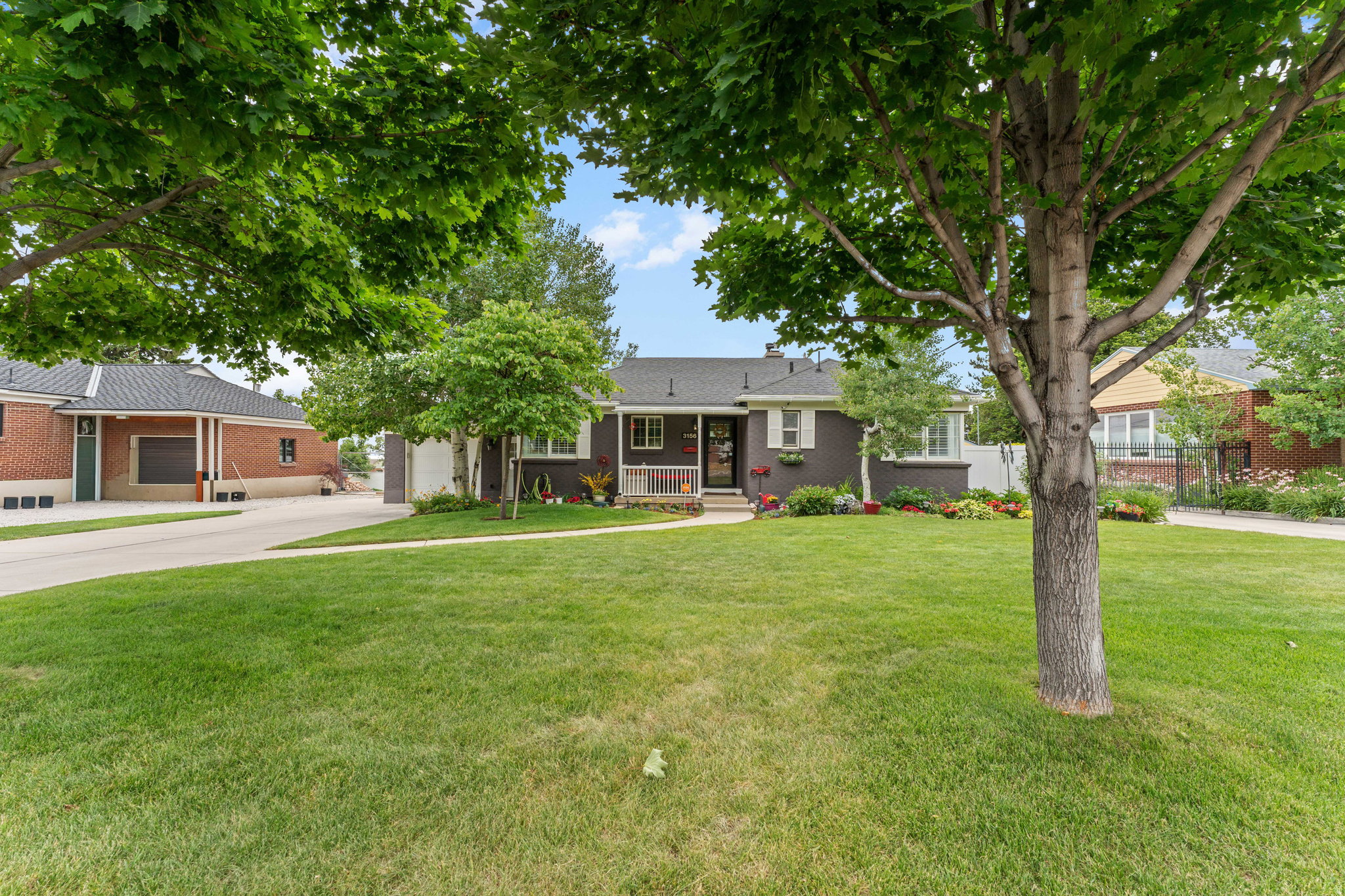 Discover this Millcreek gem where curb appeal meets everyday function. Fresh exterior paint, a new oversized 2-car garage, and an attached 1-car garage make this a rare find. An open floor plan flows to private outdoor decks, perfect for entertaining. Steps from parks, trails, shopping, dining, and quick freeway access.