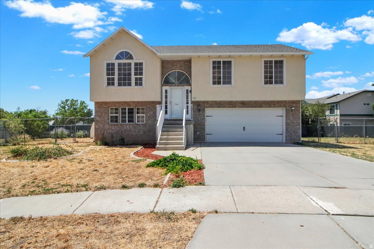 This move-in ready home is perfect for your growing family! Awesome location with stunning views of the mountains! Nestled at the end of a cul-de-sac, it features a low traffic street, a fully fenced backyard and a sweet 2-Car garage!  The kitchen features granite counter tops, newer appliances and a newly rebuilt deck to enjoy our beautiful Utah sunsets! Vaulted family room with newer laminate flooring throughout, three bedrooms, two baths, and a walkout, fully finished basement. Basement family room can easily be used as a fourth bedroom. Convenient access to I-15, schools, shopping, the mountain trail line for walking and hiking. Bring your buyers, they'll love it! Square footage figures are provided as a courtesy estimate only and were obtained from county records. Buyers are advised to obtain an independent measurement. BRING YOUR BUYERS & come tour it today!