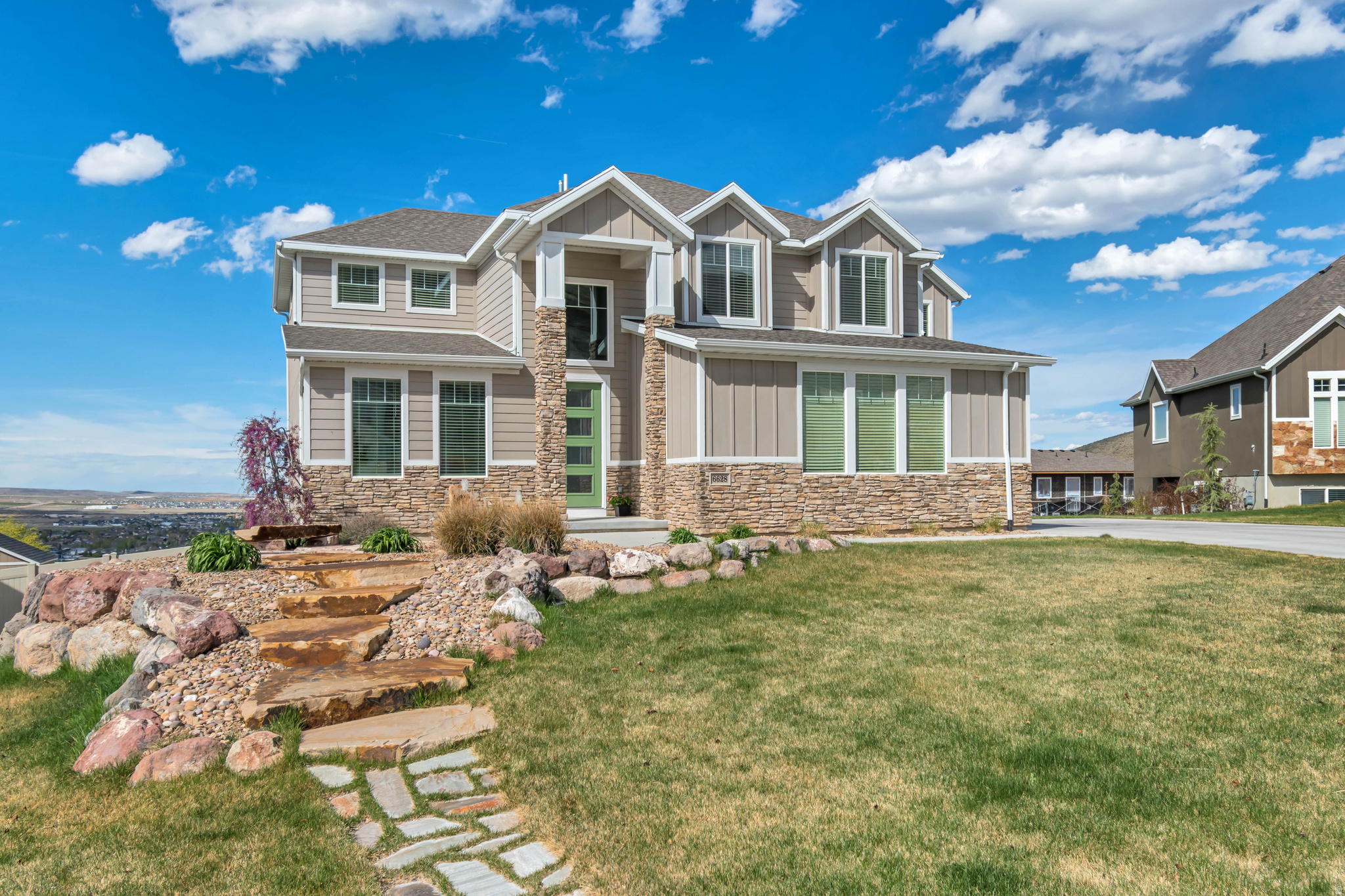 Nestled in the desirable foothills of Herriman, this beautifully designed 5-bedroom, 4.5-bathroom home offers the perfect blend of space, comfort, and scenic surroundings. The bright, open-concept floor plan is filled with natural light, creating an inviting atmosphere ideal for both everyday living and entertaining.  The spacious layout features well-appointed living areas, a thoughtfully designed kitchen, and generous bedrooms, including a luxurious primary suite. A fully finished walk-out basement provides additional living space with easy access to the outdoors-perfect for gatherings, recreation, or multi-generational living.  Situated on a meticulously landscaped 0.33-acre lot, the property offers ample room to relax, play, and enjoy the peaceful foothill setting. With its combination of modern design, functional layout, and prime location, this home is a standout opportunity in one of Herriman's most sought-after areas.