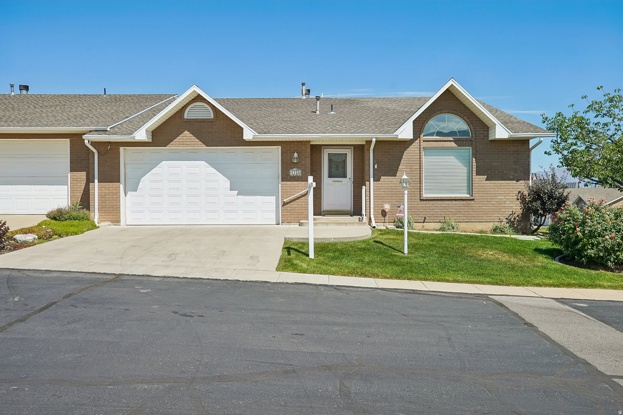 GRAND OPENING | OPEN HOUSE | JULY 25TH |  10AM-1PM | Impeccably maintained by just its second owners, this beautiful south facing end unit is truly move in ready with brand new carpet and fresh paint throughout. Enjoy stunning Wasatch Front views and abundant natural light from the spacious living areas. Designed for true main level living, all essential spaces, including the primary suite, kitchen, laundry, and garage, are conveniently located on the main floor, while the fully finished basement provides additional room for family, guests, or entertaining. An attic ventilation system helps improve airflow and keep the home cooler during Utah's warm summer months. This home has been exceptionally cared for and is ready for its next owners to move right in.