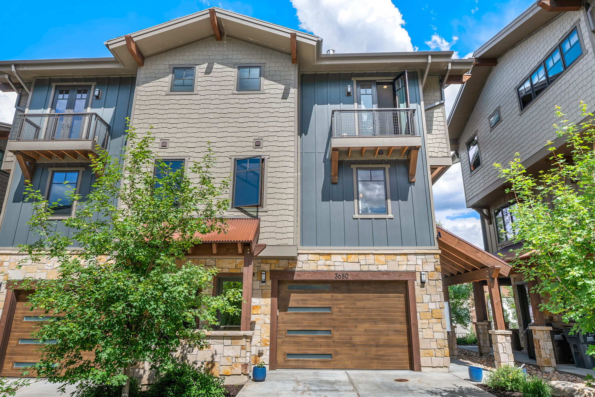 Must-see Park City townhome where elevated mountain living and year-round adventure come together in spectacular fashion. Located on Lower Village Road and bordering the 13th fairway of the Canyons Golf Course, Blackstone Residences offers an exceptional lifestyle in one of Park City's most desirable locations. Just a short walk from the Cabriolet lift or enjoy the convenience of shuttle service pickup directly from your door, providing effortless access to world-class skiing and recreation. This stunning 3-bedroom, 3-bath end-unit residence is filled with natural light and thoughtfully designed for both comfort and entertaining. The open floor plan features Viking stainless steel appliances, upgraded countertops, modern tile and natural stone finishes, tile flooring throughout the main level, upgraded canned lighting throughout the home, Grohe kitchen and bathroom fixtures, full-size LG washer and dryer, Lutron and Restoration Hardware lighting, air conditioning, Pella windows, and Trek decking. Sliding screen doors allow you to leave the doors open and enjoy the cool mountain air during summer evenings. Cozy upgraded fireplaces create the perfect retreat after a day on the slopes, while the deck off the dining area and private balcony provide inviting outdoor living spaces. The heated oversized two-car garage offers additional storage, and your private hot tub just outside the back door creates the perfect place to relax year-round. This home has been exceptionally well maintained and has never been used as an Airbnb. Blackstone residents enjoy outstanding on-site amenities including a clubhouse, pool, hot tub, fitness center, and fire ring. Ideally located near skiing, golf, hiking, biking, dining, shopping, and entertainment, this property offers the perfect balance of convenience, recreation, and mountain living. Nightly and short-term rentals are approved, making this an incredible opportunity for a primary residence, mountain getaway, or exceptional investment property in the heart of Canyons Village. Square footage figures are provided as a courtesy estimate only and were obtained from appraisal.  Buyer is advised to obtain an independent measurement.