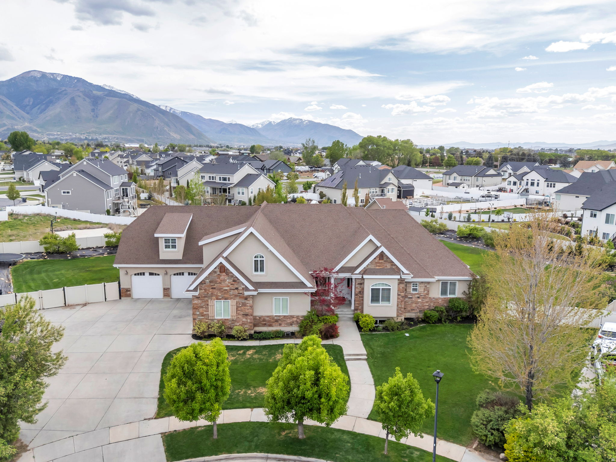 If location matters, this is the home you've been seeking. Capture breathtaking mountain views from this exceptional Mapleton estate, where refined luxury, thoughtful design, and comfortable living come together seamlessly. With 7 spacious bedrooms and 5.5 beautifully appointed bathrooms, the home offers generous scale and versatility to support both everyday living and memorable gatherings.  At the heart of the home, the gourmet chef's kitchen is as inspiring as it is functional, featuring a large, built-in, double door refrigerator, premium finishes, and a discreet walkin pantry that blends elegance with practicality-perfectly suited for everything from quiet mornings to hosting special celebrations.  Designed with connection and flexibility in mind, each level of the home features expansive gathering spaces, offering inviting settings to come together with friends, loved ones, and the people who matter most. These thoughtfully designed areas provide a blank canvas-allowing you to shape each space according to your own vision, whether that means vibrant entertaining areas, relaxed conversation zones, or serene retreats throughout the home.  Additional highlights include a music room, a custom builtin office ideal for working from home, and multiple living spaces that easily adapt to your lifestyle-giving you the freedom to create environments that reflect how you live, work, and connect.  Entertainment and recreation are elevated with a private theater room, a large open game and gathering area, and a dedicated space ideal for an exercise studio or golf simulator, offering the flexibility to design leisure experiences that suit your personal interests-all under one roof.  Step outside to an extraordinary backyard oasis where beauty meets abundance. Enjoy a private orchard with peach, apricot, apple, pear, plum, and nectarine trees, alongside thriving raspberry, boysenberry, and blackberry bushes. A spacious garden with drip irrigation and a charming garden shed enhance the opportunity for sustainable, farmtotable living and outdoor enjoyment.  Every element of this home reflects quality, comfort, and timeless elegance, beautifully set in one of Mapleton's most soughtafter locations-ready to be shaped into a living experience that is uniquely your own.