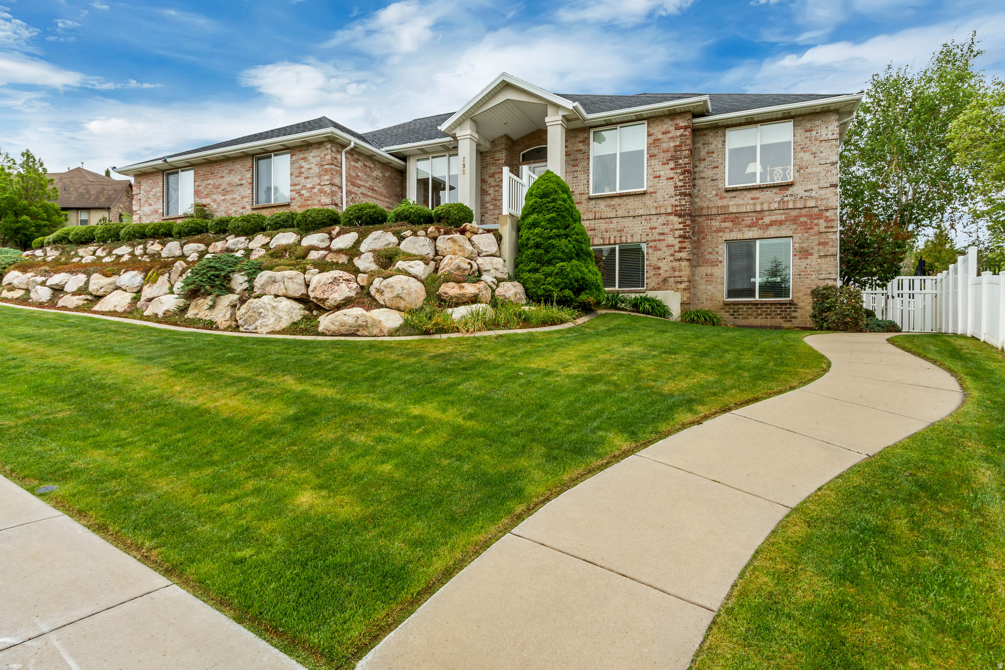 Stunning Home in the Heart of Bountiful  Views and space galore! Welcome home to this beautiful, well-maintained residence nestled in the heart of Bountiful. Built in 2000, this inviting property offers an abundance of natural light, generous living spaces, and breathtaking views in nearly every direction. Step inside to an open and airy main level featuring a spacious living room anchored by a beautiful fireplace-perfect for relaxing evenings or entertaining guests. The cozy kitchen boasts warm wood flooring, ample cabinetry, and a bright, functional layout that flows effortlessly into the main living areas.  You'll find large bedrooms with oversized closets, providing plenty of storage and comfort for family or guests. The fully finished walk-out basement is a standout feature, flooded with natural daylight. Basement includes a full kitchen, spacious living area, and separate walk-out entrance-ideal for extended family or guests.  Recent updates include a new roof (2020) and new air conditioning system (2024), giving you peace of mind for years to come. All kitchen appliances are included. The washer and dryer are also included. Additional highlights include: An extra-spacious 2-car garage, a beautifully landscaped, fully fenced backyard with mature trees offering shade and privacy. Exceptional curb appeal ! Located in a prime Bountiful neighborhood, you're just minutes from shopping, dining, major freeways, the airport, and top-rated schools. Whether you're looking for a spacious family home  this gem has it all. Don't miss your chance to own this move-in ready Bountiful beauty!  Square footage figures are provided as a courtesy estimate only and were obtained from county records.  Buyer is advised to obtain an independent measurement.