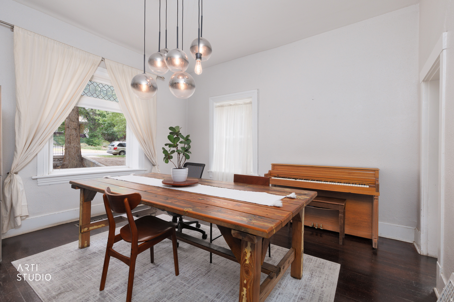 ***No showings until after the open house this weekend!*** Charming bungalow in one of Salt Lake City's historic neighborhoods, just minutes from Downtown, the Utah State Capitol, restaurants, shopping, and freeway access. This 3-bedroom, 1-bath home blends timeless character with warm hardwood floors, a cozy original fireplace, and abundant natural light.  The spacious back deck is perfect for entertaining, complete with built-in benches and plenty of room for outdoor dining. The front bedroom features a unique glass door that opens to the front yard, offering flexibility as a home office, creative studio, or private entrance. Situated in what is arguably one of the best locations in Downtown Salt Lake City, this home offers incredible potential to build equity through cosmetic updates or future improvements while preserving its historic charm. Whether you're looking for a primary residence, an investment opportunity, or fix and flip opportunity, this home is full of possibilities. (Investors welcome!)