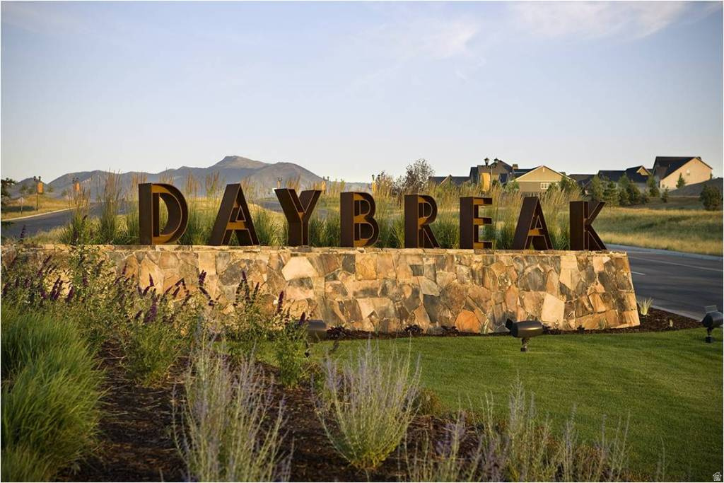 Downtown Daybreak Townhome with Stunning Views AND Walkable Location - Ideally located near the TRAX station, shopping, dining, and entertainment. The main living area in this townhome is conveniently located on the main level, creating an open and functional layout. Each bedroom features a nearby bathroom for added comfort and privacy. East-facing windows fill the home with natural light and INCREDIBLE sunrise views. Experience low-maintenance living in one of Daybreak's most vibrant and connected communities.  Photos and virtual tour are of previously completed Slate floorplan townhome.