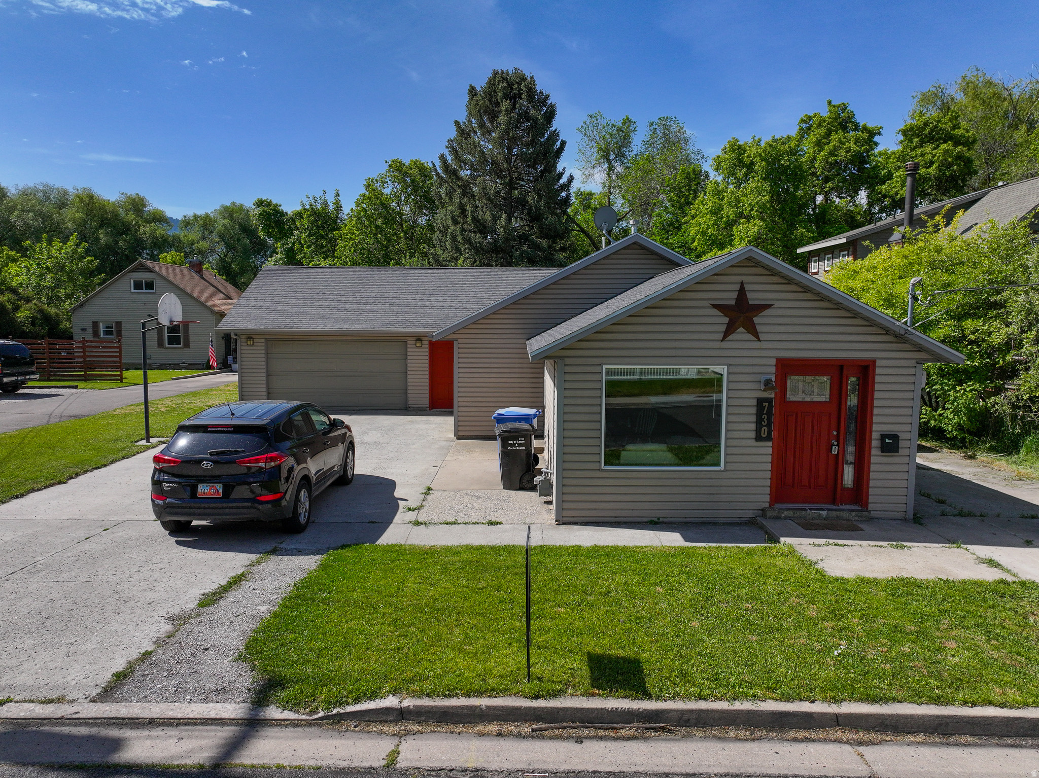 Tucked away on a whisper-quiet street, this exceptional single-level home offers the ultimate blend of peaceful Cache Valley living and unbeatable city access. You are just minutes from the breathtaking outdoor adventures of Logan Canyon, the vibrant campus of USU, and the premier dining and shopping of downtown Logan.  Step inside to a bright, open-concept floor plan designed for effortless flow and entertaining. The thoughtful layout features true single-level convenience, boasting three comfortable bedrooms and a dedicated primary bathroom. Two of the bedrooms offer direct access to a gorgeous covered deck.  Outside, the property continues to impress. The expansive yard provides endless possibilities for summer barbecues, gardening, or simply enjoying the open space. Practicality meets capacity with an oversized garage and a large, dedicated shed, ensuring you have abundant storage for vehicles, tools, and all your outdoor gear.  Properties that combine this level of privacy, single-floor accessibility, and close proximity to Logan's best amenities are a rare find.