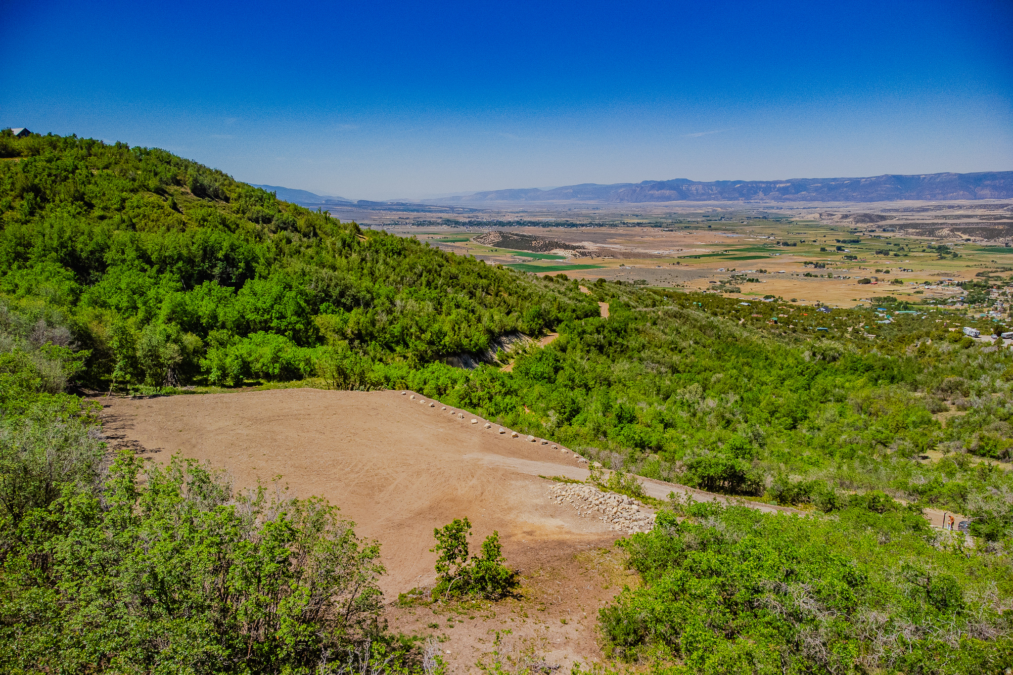 Imagine waking up to sweeping panoramic views of the mountains and valley below - every single morning, from the cabin you've always dreamed of building. This rare 2.5-acre lot in The Hollows community at Skyline Mountain Resort in Fairview, Utah is not just a piece of land. It's your launchpad to the mountain lifestyle.Just 90 minutes from Salt Lake City, this is the kind of escape that most people dream about and few actually find. Located along the legendary Skyline Drive, you'll have direct access to world-class ATV trails and snowmobiling routes right out your front door. When the seasons change, so does the adventure - world-renowned fishing and hunting, plus a short drive to the Palisade Golf Course, make every season worth staying for.As part of The Hollows community, HOA membership includes access to Skyline Mountain Resort, where there truly is something for everyone - pickleball, golf, and a swimming pool are all just minutes away, making this the perfect destination whether you're looking for adventure or a place to simply unwind with family.The hard work is already done. This lot has been excavated, graded, and thoughtfully prepared so you can focus on building, not clearing. Power and water are at the road and ready for hook-up, the driveway is in with compacted road base, a 12" culvert is installed, and a new 20' Conex container - mostly buried and fully structurally supported - is already on site and ready to serve as built-in storage or the start of something creative. In a cabin community where lots like this rarely come available, Lot 12 stands out. The prep work alone represents significant investment, and the views are simply irreplaceable. Information to be verified by buyer. Driving Directions: 39.60499, -111.38738 https://skylinemountainresort.com/