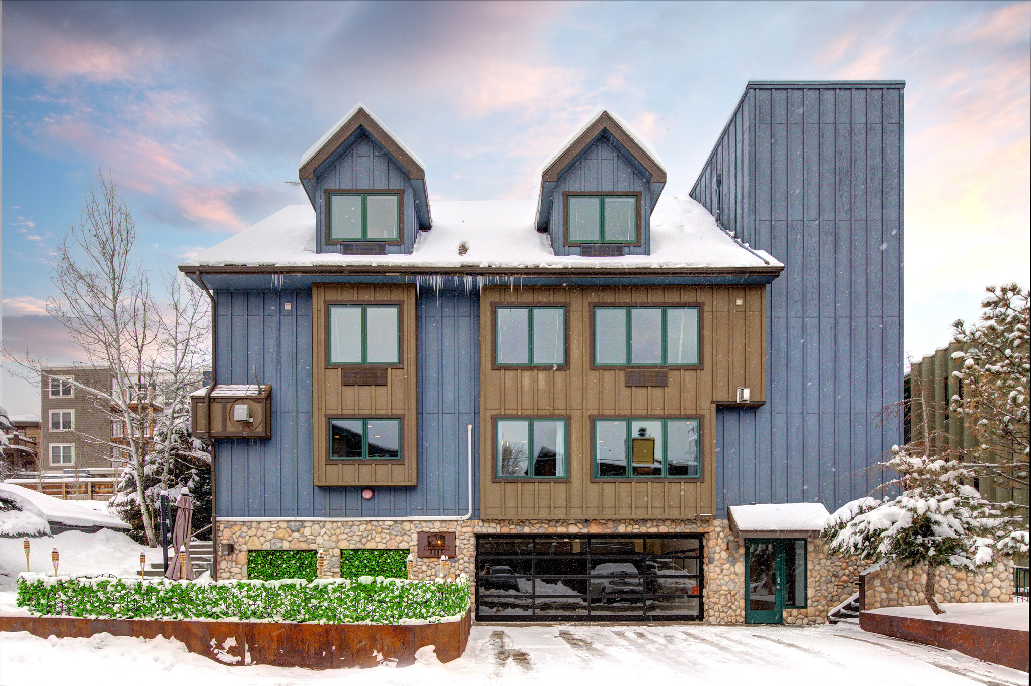 Park City's Epic Lodge is an established high-capacity rental home in Historic Old Town.  It offers the convenience of a modern boutique hotel with the privacy of a custom single-family residence.  Featuring 10 bedrooms, 9.5 bathrooms, an oversized kitchen, multiple living areas, and an additional upstairs en-suite kitchenette, this 7,123 square foot home has been impeccably maintained and upgraded.  Its spaces are light and bright with clean finishes throughout and large windows that frame surrounding mountain views.  With a stacked calendar of rental bookings that have grown substantially year over year, the property is set to continue nightly rentals at a handsome return rate immediately with 2026 into 2027 already well booked out.  Additional highlights include individually zoned air-conditioned and heated suites, open kitchen and living spaces, granite countertops, bar and billiards area, an oversized laundry room, a private hot tub grotto, fire sprinkler systems, elevator access to all levels, and an expansive ski prep and sauna lounge.  The perfect day is just footsteps away from the Epic Lodge, with award-winning skiing, dining, and shopping located within easy walking distance. Reviews from guests have been outstanding, for both it's walkability and the ability to accommodate family reunions, multi-family ski trips, and corporate retreats.  Don't miss out on this rare opportunity to own one of Park City's best producing rental income properties!