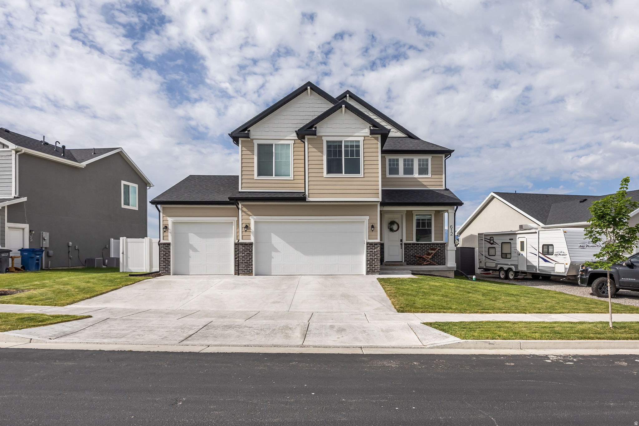 Located in the Village at Fox Meadows, this barely lived-in home is ready to go. Skip the construction wait. The exterior landscaping is 100% complete and the backyard is fully fenced. The property backs up directly to community space, giving you clear views right from your yard. The neighborhood delivers a premium lifestyle with walking trails, parks, pickleball courts, and a swimming pool located right inside the community. Step inside to a two-story entryway, 9-foot ceilings, and smart home features. The main living space is ready to host, featuring granite counters, stained cabinets, and a gas fireplace. The primary bedroom offers a large walk-in closet, double sinks, and a spacious shower! And as an added bonus, the insulated garage features an extended third-car bay to handle your extra vehicles and gear storage. Square footage figures are provided as a courtesy estimate only and were obtained from county records.  Buyer is advised to obtain an independent measurement.