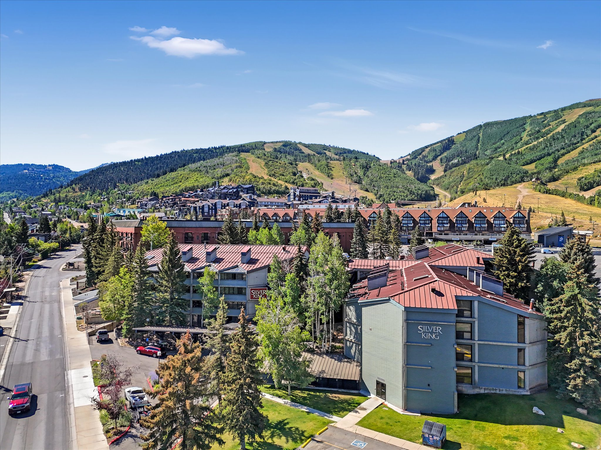 Experience the best of Park City mountain living in this 1 bedroom, 2 bath Silver King residence, ideally located just steps from the ski lifts at Park City Mountain Resort. Offering 870 square feet of comfortable living space, this fully furnished, turn-key condo is the perfect year-round retreat, vacation home, or investment property with nightly rentals permitted. The spacious floor plan features a full kitchen with granite countertops, a welcoming living area, and ample space to comfortably accommodate family and guests. There is also a built in murphy bed strategically situated away from the main living area. Large windows with tons of natural light. Owners also enjoy a dedicated ski locker room with private locker and a side entrance that leads straight to the lifts. Main level so no stairs and no elevator needed. Silver King owners enjoy an exceptional collection of resort-style amenities, including a heated indoor/outdoor swimming pool, hot tub, sauna, fitness center, ski locker room, onsite management, front desk services, and secure underground parking. HOA dues cover all utilities, providing a low-maintenance ownership experience. Conveniently situated on the free Park City bus route, you'll have easy access to Historic Main Street's renowned dining, shopping, galleries, and year-round events. Whether you're seeking world-class skiing, mountain adventures, rental income potential, or simply a place to unwind in one of Park City's most desirable locations, this Silver King condominium delivers the perfect combination of comfort, convenience, and mountain lifestyle.