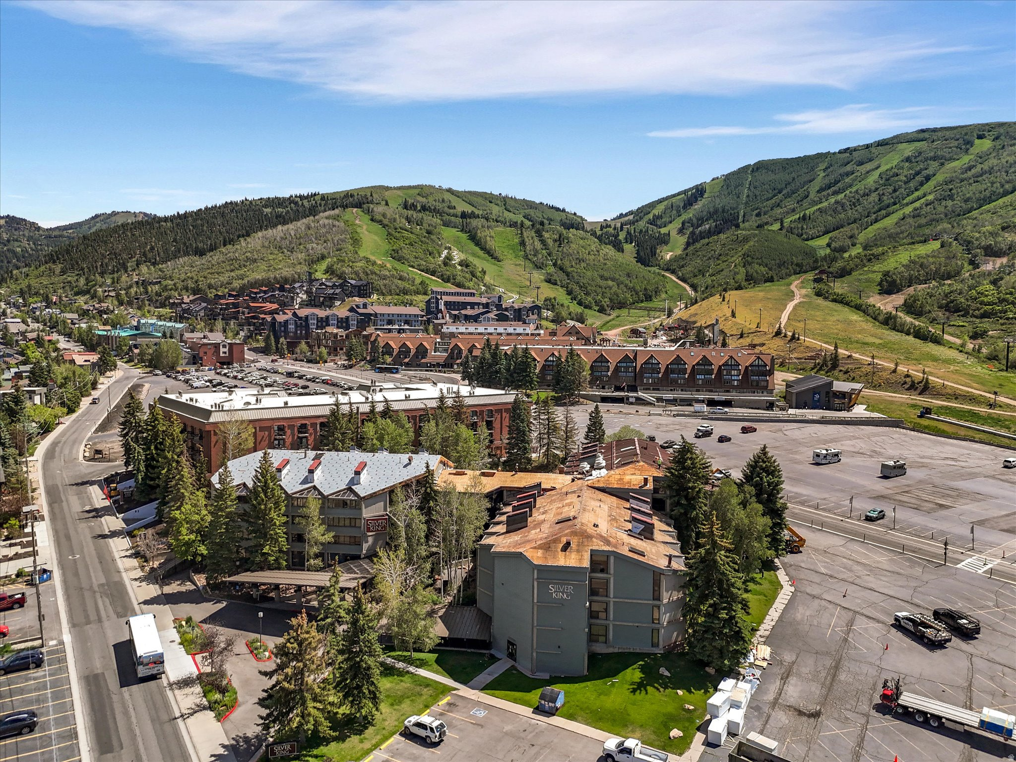 Experience the best of Park City mountain living in this 1 bedroom, 2 bath Silver King residence, ideally located just steps from the ski lifts at Park City Mountain Resort. Offering 870 square feet of comfortable living space, this fully furnished, turn-key condo is the perfect year-round retreat, vacation home, or investment property with nightly rentals permitted.  The spacious floor plan features a full kitchen with granite countertops, a welcoming living area, and ample space to comfortably accommodate family and guests. Large windows frame mountain and ski run views, creating a true alpine escape in every season.  Silver King owners enjoy an exceptional collection of resort-style amenities, including a heated indoor/outdoor swimming pool, hot tub, sauna, fitness center, ski locker room, onsite management, front desk services, and secure underground parking. HOA dues cover all utilities, providing a low-maintenance ownership experience.  Conveniently situated on the free Park City bus route, you'll have easy access to Historic Main Street's renowned dining, shopping, galleries, and year-round events. Whether you're seeking world-class skiing, mountain adventures, rental income potential, or simply a place to unwind in one of Park City's most desirable locations, this Silver King condominium delivers the perfect combination of comfort, convenience, and mountain lifestyle.