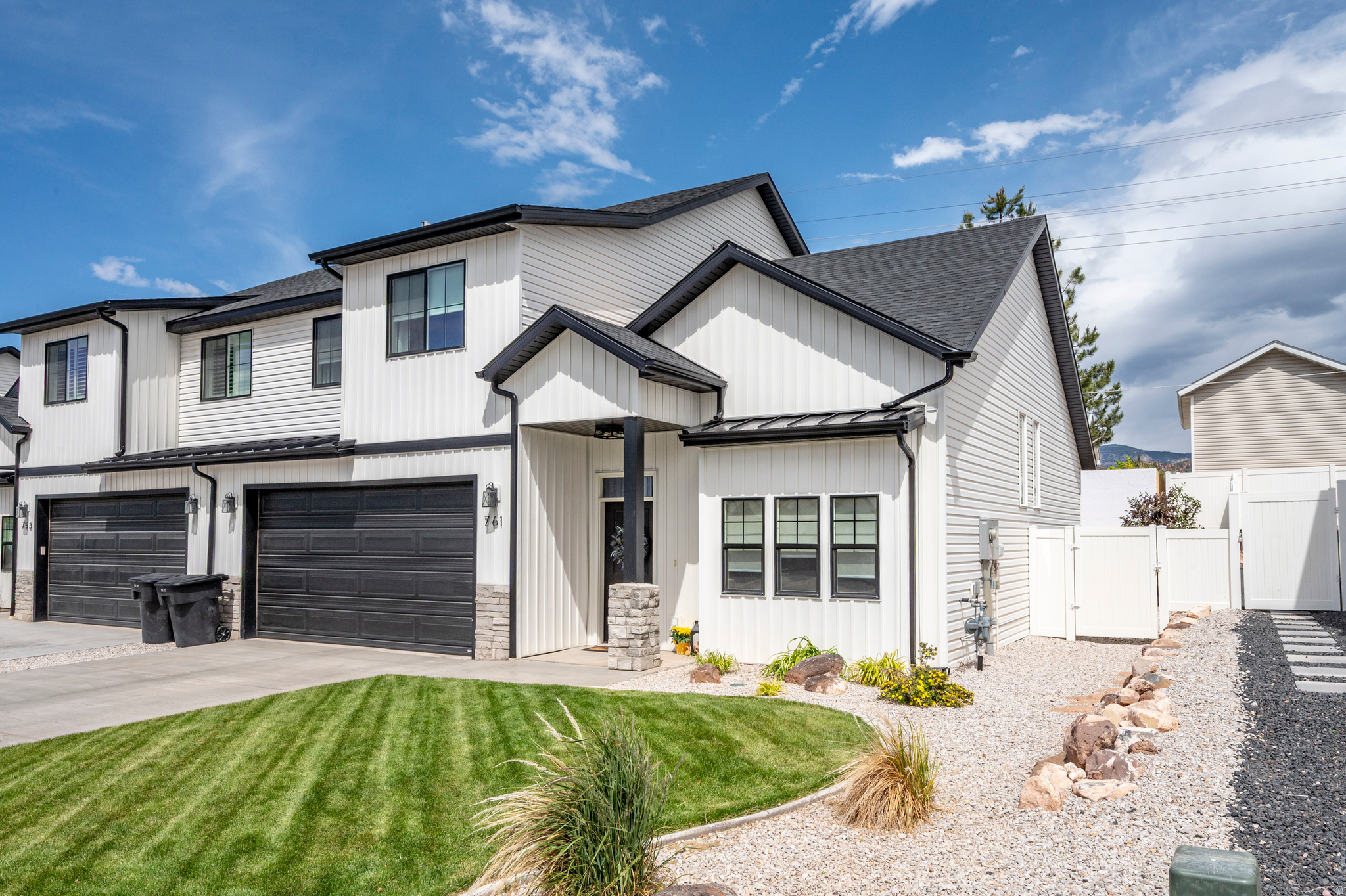 This Twin home, built in 2023, offers modern living with thoughtful upgrades. Inside, you'll find Graber blinds and drapes throughout, along with premium quality carpet installed 18 months ago. The kitchen is equipped with a high-end dishwasher, gas stove, custom wall tile, and a sleek stove vent hood, making it a chef's delight. A soft water system ensures soft water in showers and sinks. The custom library is a standout feature with elegant French glass doors, opening into a space with built-in shelves for over 1,200 books, ideal for a private retreat. The living area includes a gas fireplace, adding warmth to the space. Outside, the well-maintained landscaped front yard and fully fenced backyard with a large patio offer great outdoor space and privacy