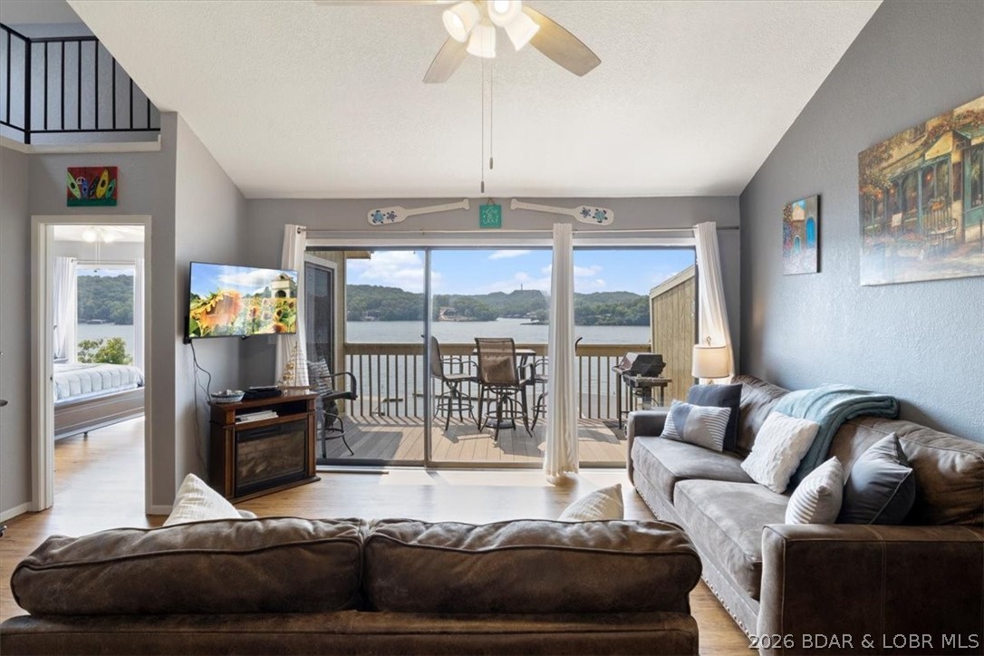 Incredible views and a 14x36 boat slip! Top-floor 3BR/2BA condo (3rd bedroom is a loft) in a prime Lake of the Ozarks location—easy access by both land and water. This well-maintained, updated unit is light, bright, and nearly turnkey, offered mostly furnished (see inventory list). The open floor plan features vaulted ceilings, a stylish white kitchen with stainless appliances, and durable laminate flooring throughout. Enjoy beautiful main channel views from your living space and deck. The loft provides a flexible third bedroom—perfect for kids or additional guests—and includes a skylight for added natural light. A standout feature is the oversized 14x36 boat slip, protected by a breakwater—ideal for larger boats and enhanced calm-water docking. Located in the desirable Bay Point Village community, offering acres of manicured grounds, two pools, tennis courts, and boat trailer parking. Whether you’re seeking a vacation rental, weekend retreat, or full-time residence, this property checks all the boxes. Schedule your showing today!