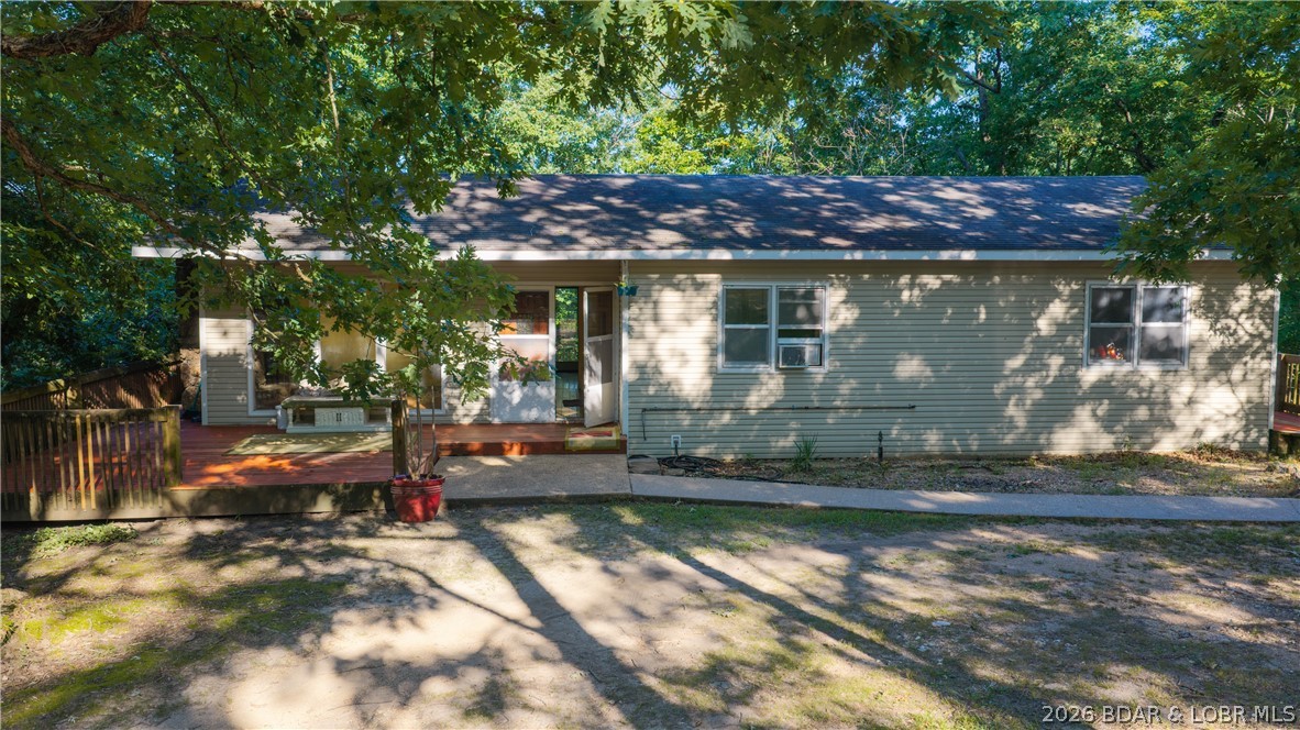 Opportunity awaits in the desirable Lakeview Acres Subdivision! Situated on approximately 3 acres, this 2,856 sq. ft. home offers 4 bedrooms, 3 bathrooms, and the convenience of main-level living in a peaceful, quiet neighborhood. The flat front yard provides plenty of usable space for outdoor activities, while lake access lets you enjoy everything lake life has to offer. This fixer-upper is ready for your vision and offers endless potential to create your own private retreat. A detached 2-car garage provides extra storage and workspace, and there's plenty of room to expand or add additional amenities. With a private well and septic, you'll enjoy added privacy and independence. Conveniently located just minutes from shopping, dining, and entertainment, this property combines country charm with everyday convenience. Whether you're looking for a full-time residence, vacation getaway, or investment opportunity, this is your chance to make your own piece of paradise at the Lake of the Ozarks. Property is being sold As-Is.
