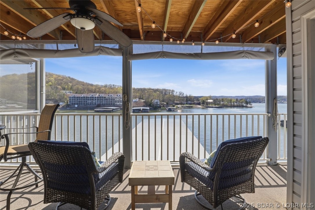 CURRENTLY THE BEST PRICED 2 BEDROOM UNIT AT THE VISIONS! Welcome to easy lake living on the peaceful Big Niangua arm of Lake of the Ozarks! This charming 2-bedroom, 2-bath lakefront condo is located in a small, quiet complex with only four buildings. Just one short flight of stairs to a comfortable, furnished retreat featuring a beautiful stone gas fireplace that’s perfect for cozy evenings. The screened porch offers an incredible view of a wide, protected cove—ideal for morning coffee, evening sunsets, and keeping an eye on the calm water that’s perfect for paddle boarding, kayaking, or swimming. Boaters will love the included 12x30 boat slip with hoist in the community dock located close to the unit.

The self-managed complex keeps assessments affordable and stress levels low, plus there’s a heated (which makes the swimming season longer) community pool for cooling off on those warm lake days. The condo also features a newer HVAC system, and the complex has recently installed new roofs and a new septic system for added peace of mind. Conveniently located with easy highway access and just minutes from the popular Cave Bar & Grill.
ONE YEAR HOME WARRANTY OFFERED WITH FULL PRICE