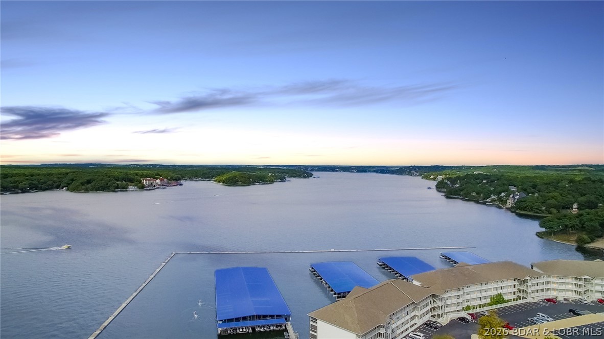Don’t be the buyer who looks back and says, “I should have bought that one.” This Lands’ End property is positioned directly across from the new Oasis development, one of Osage Beach’s most exciting upcoming destinations with roller coasters, a Ferris wheel, rides, an indoor/outdoor amphitheater, and an indoor water park and comes turn-key. Combine that with Lands’ End’s resort-style amenities, including a pool, lazy river, splash pad, billiards, clubhouse, fitness center, playground, and basketball court, and you have a property that delivers both lifestyle and investment appeal. Even better, this property includes a 12x36 boat slip. There is a PWC slip available for additional cost. Opportunities like this do not come along often. You'll want to see this one before it is too late.