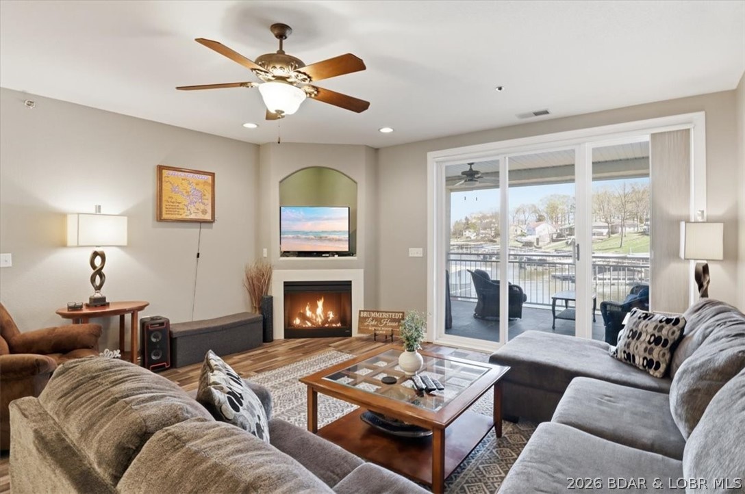 Luxury Lakefront Living at Majestic Pointe! Located at the 12MM in an exclusive gated community of only 24 units, this beautifully updated 3BR/3BA condo offers the perfect blend of comfort, style, and convenience. This desirable lower-level unit features elevator access from driveway to dock, providing easy, no-step living. The open-concept layout is designed for entertaining, with granite countertops, tiled backsplash, updated appliances, and a bright, spacious living area. Step outside to the screened-in, tiled deck and enjoy peaceful lake views the ideal setting for morning coffee or sunset relaxation. The spacious primary suite includes a jetted tub, walk-in shower, and updated finishes. Enjoy beautifully maintained grounds, a lakefront pool, and easy access to your 12x32 boat slip. Whether you’re seeking a full-time residence or a weekend retreat, this exceptional condo delivers the ultimate Lake lifestyle.