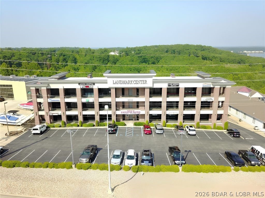 Position your business for success with this high-visibility professional office space located right on Osage Beach Parkway in the heart of Osage Beach. This well-designed space offers over 1,700 sq. ft. with a layout that’s both functional and flexible—ideal for a variety of professional uses. Property Highlights: Excellent highway frontage & exposure; 1,700+ sq. ft. of usable space; 5 private offices – perfect for teams or individual workspaces; Spacious reception area with potential to convert into a conference room. Space includes: Kitchen/break room; 2 restrooms; Ample room for customization to fit your business needs; Elevator Access; Class A building within the REMAX campus. Whether you’re expanding, relocating, or launching something new, this space offers the location, layout, and flexibility to support your growth. Centrally located in Osage Beach—easy access for clients and employees alike with ample parking. Business use subject to restrictions and association approval.