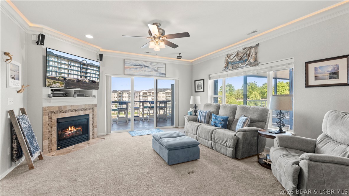 This exceptional 3-bedroom, 2.5-bath fully furnished lakefront condo offers the ultimate "turn-key" Lake of the Ozarks experience. Positioned as the original "model" unit, it boasts superior details and numerous upgrades, including crown molding with accent lighting, stainless steel appliances, and granite countertops. Some of the key condo features are elevator access that opens directly in front of  the unit. Open-concept living, dining, and kitchen area with tasteful, included furnishings. Screened-in lakeside patio equipped with high-quality matching Polywood furniture. A cozy fireplace designed with plumbing capabilities to allow an outdoor spigot for grilling. Access to three community pools. Includes a 12' x 36' boat slip. Conveniently located at the 2mm, providing quick access to restaurants, golf, and shopping. Complete your lake lifestyle with the optional, separate purchase of the seller's boat and hoist: 2015 Bennington Tritoon 25R, 250HP Mercury Outboard with only 415 hours, 10,000 lb capacity hoist already installed in the slip. This is a rare opportunity to purchase a meticulously maintained, model-level unit with top-tier amenities at the Midwest Coast.
