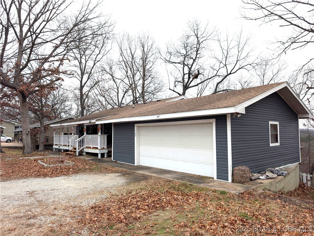 What a lovely family home with large rooms so close to the Lake of the Ozarks, MO, that you can see the lake from the back of the house. This precious home has a very large and workable kitchen with lots of counter space. The home is set up with a living room on the upper floor and a family room and a bedroom on the lower floor- a total of 3 bedrooms and 2 living spaces - great for kids or a family member wanting to live in the lower level. There is a door outside that could be accessed, providing a private entrance. The front of the house is very attractive with a large front deck across the whole front of the house...out back in the fall, winter, and early Spring, you have a nice view of the Lake - otherwise it is a nicely wooded and private view...The two decks on the back of the house provide ample outdoor living space - and end in a totally fenced back yard. Nice. There is a local marina nearby that could provide a space for your boat and a nice inexpensive way to utilize the Lake of the Ozarks, MO. come take a look - and bring your checkbook.
