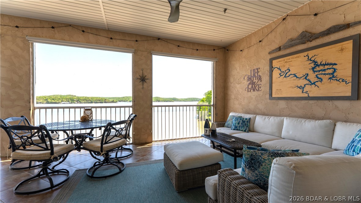 Experience refined lakefront living in this fully updated top-floor condo at Royale Palms Vista, offering breathtaking panoramic main channel views at the 34MM. The open-concept layout with soaring ceilings immediately captures the water from the moment you enter. This 3BR/2BA unit has been extensively remodeled with modern, high-end finishes throughout, including new LVP flooring, fresh carpet, and updated paint. The kitchen is a standout, featuring custom cabinetry, quartz countertops, a large stainless sink, and matching stainless appliances—ideal for both everyday living and entertaining. Both bathrooms continue the elevated design with custom cabinetry, quartz surfaces, and vessel sinks, creating a clean, spa-like feel. Enjoy the expansive, fully screened deck with incredible sunrise views, main channel activity, and a front-row seat to lake events near Captain Ron's. Royale Palms Vista offers a clubhouse, fitness center, lakeside pool, playground, on-site maintenance, and quick Hwy 5 access. Includes 12x32 slip - everything you need to start enjoying the Lake immediately. Plenty of parking here... 2 designated owner spaces and overflow parking lot for guests.