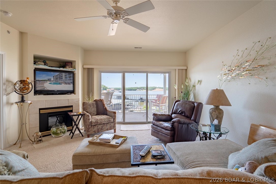Whether you're searching for a vacation getaway, investment opportunity, or full-time lake retreat, this Fountainview Landing condo delivers the location and lake lifestyle buyers are looking for. Located at the 19 MM in the heart of Osage Beach, this walk-in 3-bedroom, 2-bath condo offers 1,430 sqft, elevator, a 12x32 slip, and the flexibility of nightly rentals.The open-concept floor plan features a spacious kitchen with ample cabinetry, breakfast bar seating, dining area, and a living room that opens to the covered lakeside deck. Enjoy partial main channel views while benefiting from the protection of a cove location. The primary suite offers private deck and an en-suite bath, while the guest bedroom and bath provide privacy for family and friends. Recent flooring updates add to the appeal.Owned by the same family since it was built, this condo has been enjoyed as a vacation retreat and is ready for its next chapter. Complex offers community pool, playground, elevator, and a highly desirable location by both land & water. Minutes from popular waterfront destinations including Dog Days and the new Oasis development, you'll be close to shopping, dining, entertainment.
