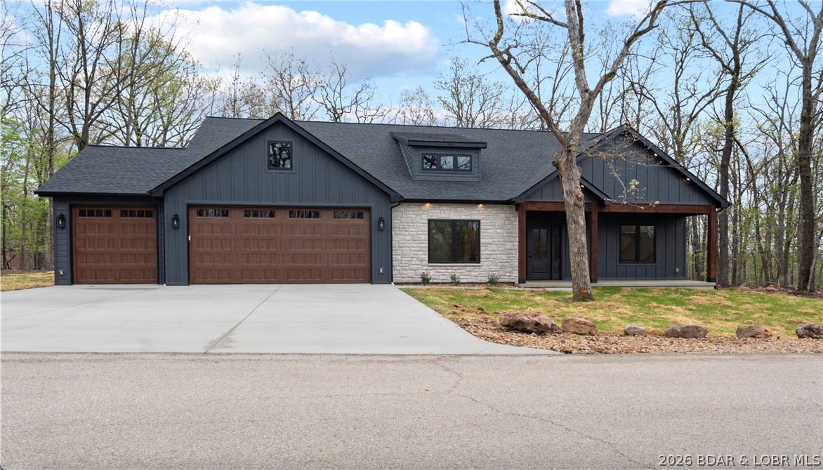 Discover your Porta Cima retreat — a single-level ranch home offering effortless living and exceptional privacy. This inviting 3-bedroom, 3-bath residence sits on a hard to find flat, wooded lot and features an oversized 3-car garage perfect for boat trailers or a work bench area, covered front and back porches ideal for morning coffee, and a versatile bonus office perfect for remote work or a hobby room. The ranch-style floor plan provides easy one-level flow with a spacious primary suite and ample storage, while private wooded views create a tranquil setting on a quiet street. Enjoy quick access to dining, shopping, marinas, and recreational amenities at the Lake of the Ozarks. Comfortable, private, and ideally positioned for lake life.