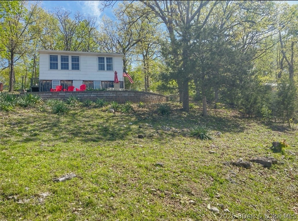 Lake views, three lots, and opportunity, this is the kind of property buyers wait for.
Charming 2-bedroom, 2nd tier lake cabin in Barnett, MO with beautiful water views and a relaxed lake setting. This cozy home features an open living room and kitchen layout, creating a comfortable space to unwind after a day on the water.
Situated on three lots, this property offers added flexibility and space.
Perfect as a weekend fishing retreat, personal getaway, or investment opportunity, this property offers strong potential with multiple opportunities to enhance and maximize value. A smart move before peak lake season hits.