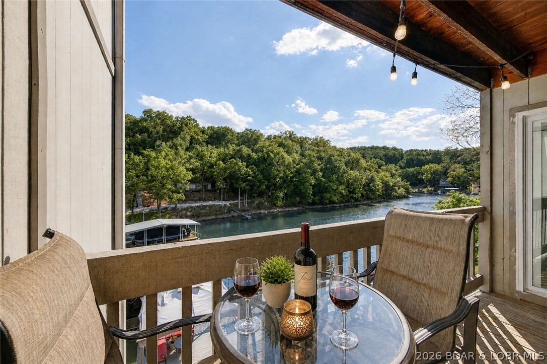At some point, weekends at the lake start to feel too short… and you catch yourself wanting a place that’s always there. Mornings begin on the balcony with calm water and coffee in hand. Afternoons drift between the pool and shoreline, and by evening, everything slows down. Tucked into a quiet no-wake cove at Eagle Bay, this 2BR/2BA condo carries a clean, modern feel throughout. The kitchen opens up with quartz countertops, stainless steel appliances, and a large island that naturally becomes the gathering spot. Thoughtful touches—like the hidden barn door to the laundry/pantry and a tiled shower with rain head in the primary suite—add character you don’t often find in this price range. Step outside to your private balcony overlooking the pool and wooded lakefront. Just steps to the water, with a community dock for fishing or unwinding. Eagle Bay is a 24-unit community with no rentals, creating a quieter, more personal lake experience. And for those used to renting weekends or weeks… it starts to shift your perspective. Owning your own place at the lake—close to restaurants, shopping, and the Bagnell Dam Strip—just begins to make more sense.
The kind of place that’s hard to leave