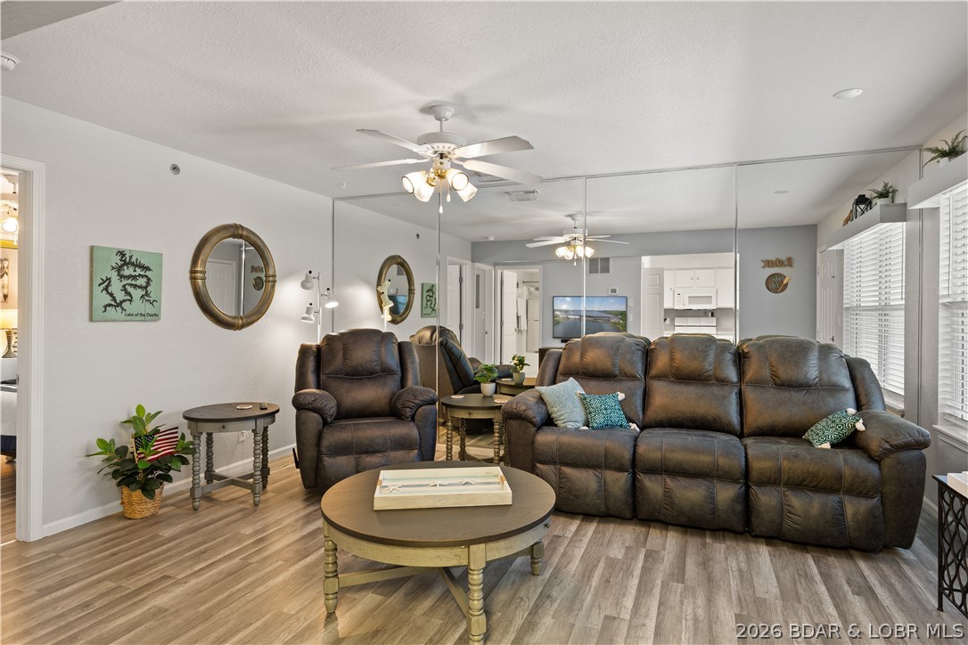 This fully furnished 2-bedroom, 2-bathroom condo at Lighthouse Landing Condominiums presents a budget friendly option to get started with a second home or vacation rental investment at the beautiful Lake of the Ozarks! This clean and cozy condo features an open floor plan, covered and screened lakeside deck, and a nice lakeview. Recent upgrades include new flooring and screens on the deck, living room furniture, new beds in the bedrooms, and comfort height toilets. Perfect for boating enthusiasts, it includes a 12’ x 32’ boat slip, two PWC slips, and 2 PWC hoists, making it easy to enjoy endless days on the water. Whether you're looking for a personal getaway or a lucrative vacation rental investment, this turn-key property is ready to go! Lighthouse Landing is one of the few condo communities to allow swimming off the docks and offers a prime location, just minutes from popular restaurants, entertainment, and shopping. Don’t miss this incredible opportunity to own your slice of lakefront paradise! 13,500 pound boat lift available to purchase. Lift is a 2024 and is set up for V hull and/or Pontoon.