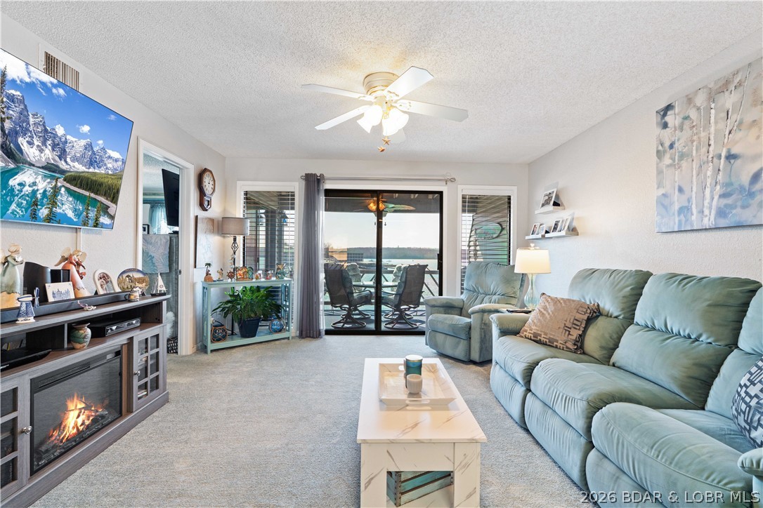 Motivated sellers! Experience the ultimate lakefront lifestyle at Golden Reef! This adorable 2-bedroom, 2-bathroom walk-in level condo is where modern upgrades meet unbeatable views, for an incredible price of $255,000. Perfectly situated to offer a front-row seat to the world-famous Shootout from your private deck, minutes from the state park. It comes furnished, including a big 65" TV in the living room and a 50" TV in the master suite. Comes with a 10'x30' boat slip (3' overhang allowed, will hold a 32' boat). The kitchen features SS appliances, a stylish backsplash, and a reverse osmosis filtration system for pure, crisp water. Major essentials already updated with a newer washer/dryer and water heater installed in 2022. All lakeside windows are professionally tinted, keeping cool and private. A double storage closet(2'x4'x8' ea) in front of condo is nice for boat/fishing essentials. Beyond the front door, Golden Reef offers premium amenities, including a new pool (2022), the rare convenience of on-site boat trailer parking and a beach area for floating. Whether you’re seeking a vacation getaway or a smart investment, this gem is ready for you.