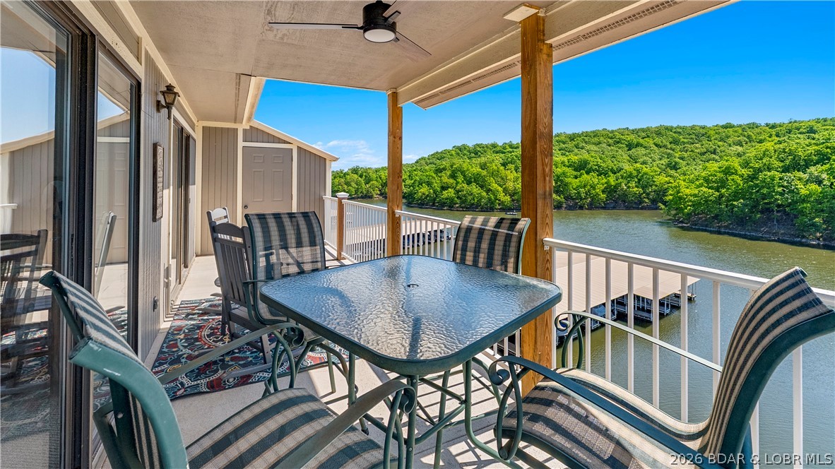 Looking for lake life without the maintenance? This top floor, turn-key condo has vaulted ceilings and your own boat slip located just outside the unit. The Lazy Days complex gives you access to two pools, a playground, BBQ pavilions, a boat ramp, trailer parking, a dog park, and a game area - everything you or your guests need to enjoy the lake. Nightly rentals are allowed, giving you the ability to use it as a personal getaway, as an investment property, or both. Located in a calm, no-wake cove, you can swim directly off the dock and enjoy the water without the heavy boat traffic. Surrounded by Lake of the Ozarks State Park, your natural views are protected, ensuring privacy and that your beautiful scenery won’t change. Plus, you’re located within the new Lake of the Ozarks Shootout location, keeping you close to one of the lake’s biggest attractions. The complex is also located down the road from Harley Davidson, offering an excellent opportunity for renters during bike fest - another one of the lake's biggest attractions. This condo is low maintenance, has strong rental potential, and offers easy lake access. Come see it for yourself!