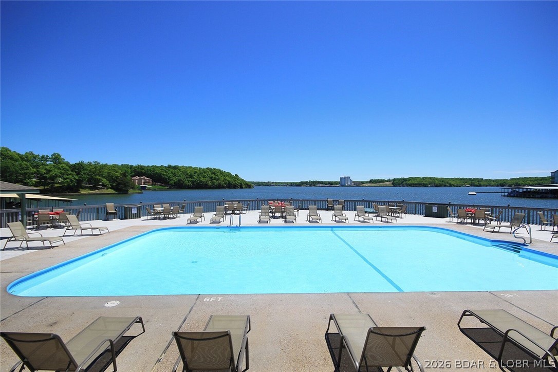 Enjoy lake living at its finest in this beautifully updated 2-bedroom, 2-bath condo in Lake Ozark! This fully furnished unit offers a comfortable and inviting floor plan, making it the perfect full-time residence, weekend getaway, or investment opportunity. Conveniently located just steps from the water, you'll love having your own boat slip and boat lift for easy access to the lake. Spend your days boating, fishing, or simply relaxing while taking in the waterfront atmosphere. This property also boasts an excellent rental history, providing outstanding income potential for investors. Located near popular dining, shopping, and entertainment, this move-in-ready condo is your opportunity to start enjoying the Lake of the Ozarks lifestyle immediately. This property is agent owned.