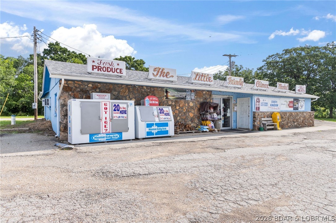TURNKEY Highway-Front Grocery Store plus extra on 2.2 Acres located in the heart of Climax Springs MO! Incredible opportunity to own a fully operational, turnkey grocery store with unbeatable highway frontage between Camdenton and Warsaw! This established hometown grocery store has served the community for decades and includes over $100,000 in inventory for a seamless transition to the next owner. Situated on 2.2 flat acres with high visibility, the property features a 2-year-old roof and gutters, ample parking, and additional storage in a 30x20 shed. The backroom includes a walk-in cooler for easy inventory management. Also included is a 3-bedroom, 2-bath manufactured home with a fenced yard--perfect as a residence, rental, or continued storage. With no competing stores nearby, this is the only grocery option in the area, offering both local and vacationing customers. A rare investment with strong community roots, business potential, and live-on-site flexibility. Don't miss this chance to own a piece of small-town legacy!