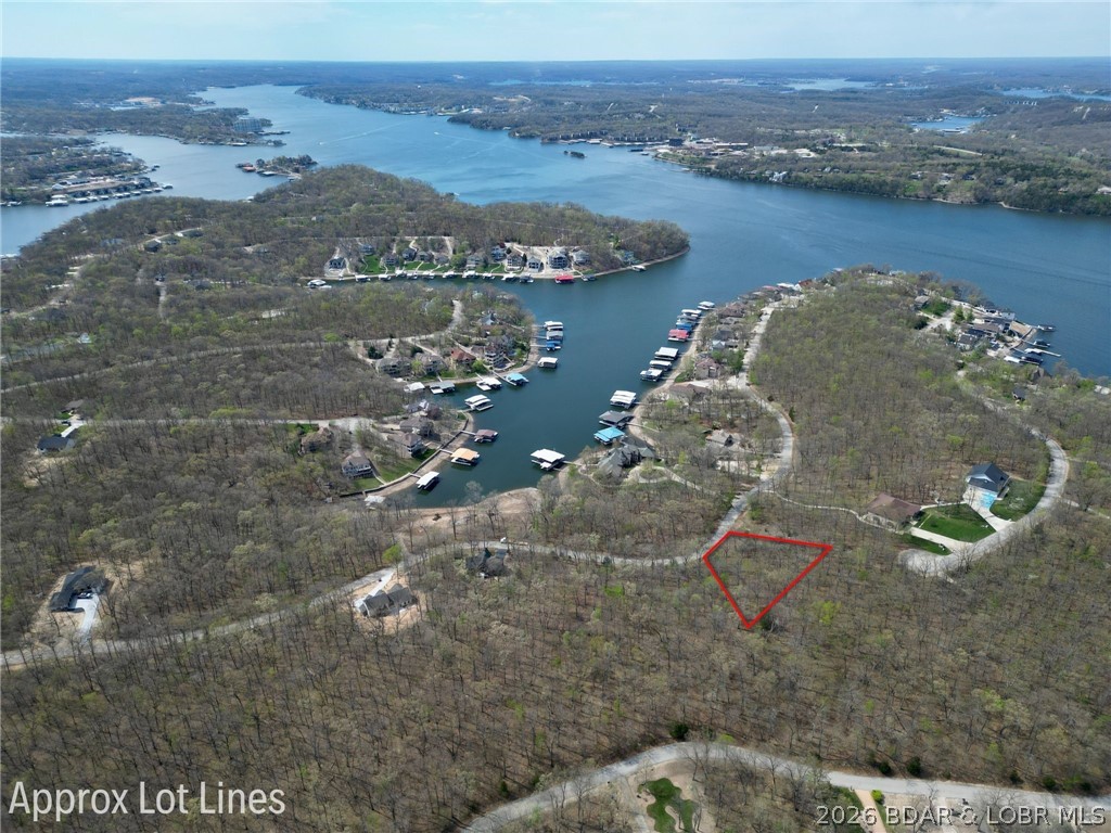 Discover the perfect setting to bring your dream home to life in the highly sought-after Porto Cima community, located within the desirable Grand Point subdivision. This spacious vacant lot offers an excellent opportunity to build in one of the lake’s most prestigious and well-established areas. Surrounded by beautiful homes and a peaceful atmosphere, the property provides the ideal balance of privacy and convenience. Porto Cima is known for its upscale amenities and easy access to everything Lake of the Ozarks has to offer, making lake living both effortless and enjoyable. Whether you’re planning a full-time residence or a vacation retreat, this property offers the flexibility to create a home that fits your vision. Enjoy the tranquility of a quiet neighborhood while still being just minutes from golf, dining, marina access, and more. Don’t miss this opportunity to secure a prime piece of land in one of the lake’s premier communities.