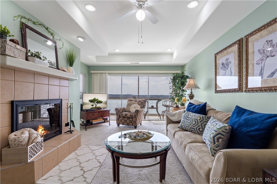 Wake up to wide lake views and end the day the same way—this condo is all about easy lake living. Located just down HH, this well-kept 2-bedroom, 2-bath condo offers quick access to Osage Beach restaurants, shopping, and entertainment while still tucked away in a quieter setting. Sold fully furnished and truly move-in ready, it also features a newer AC updated just 2 years ago. Whether you're looking for a personal getaway or an investment property, nightly rentals are allowed. The open layout flows right to the screened-in deck where the lake views become the highlight of every morning and evening. Boaters will appreciate the included 12x28 boat slip plus a PWC slip for quick access to some of the best water at the lake. Conveniently located directly across from one of the two pools and tennis courts, with additional amenities including a clubhouse, fitness area, and double storage for easy lake living.