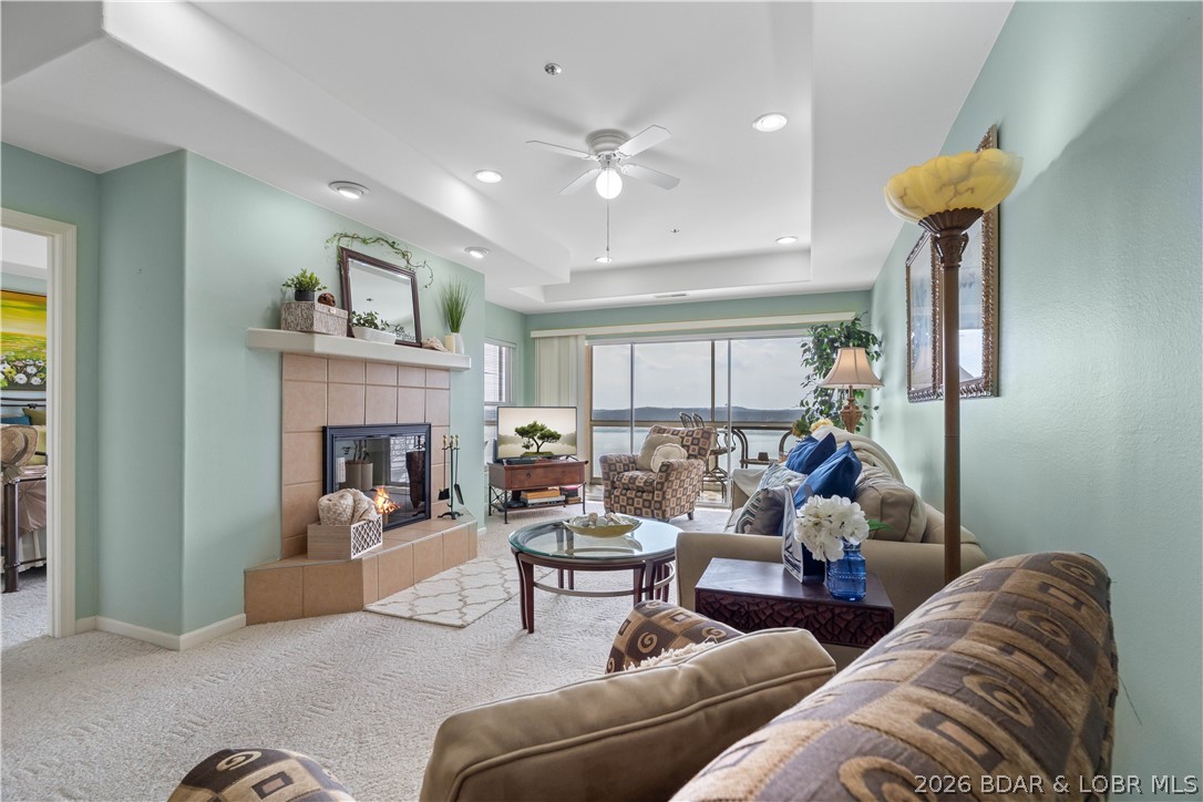 Lake days are simply better here! Located down HH in a peaceful setting, this well-maintained 2-bedroom, 2-bath condo offers the perfect balance of relaxation and convenience, just minutes from Osage Beach restaurants, shopping, and entertainment. Sold fully furnished and truly move-in ready, it also features a newer HVAC system installed just 2 years ago. The open floor plan flows seamlessly to the screened deck, creating the perfect spot to enjoy the beautiful lake views year-round. Whether you're looking for a weekend getaway, full-time condo, or income-producing investment, nightly rentals are allowed. Boating is easy with the included 12x28 boat slip plus a PWC slip. Conveniently located directly across from one of the two pools and tennis courts, you'll also enjoy access to a clubhouse, fitness area, and double storage. Everything you need for easy Lake of the Ozarks living is right here.