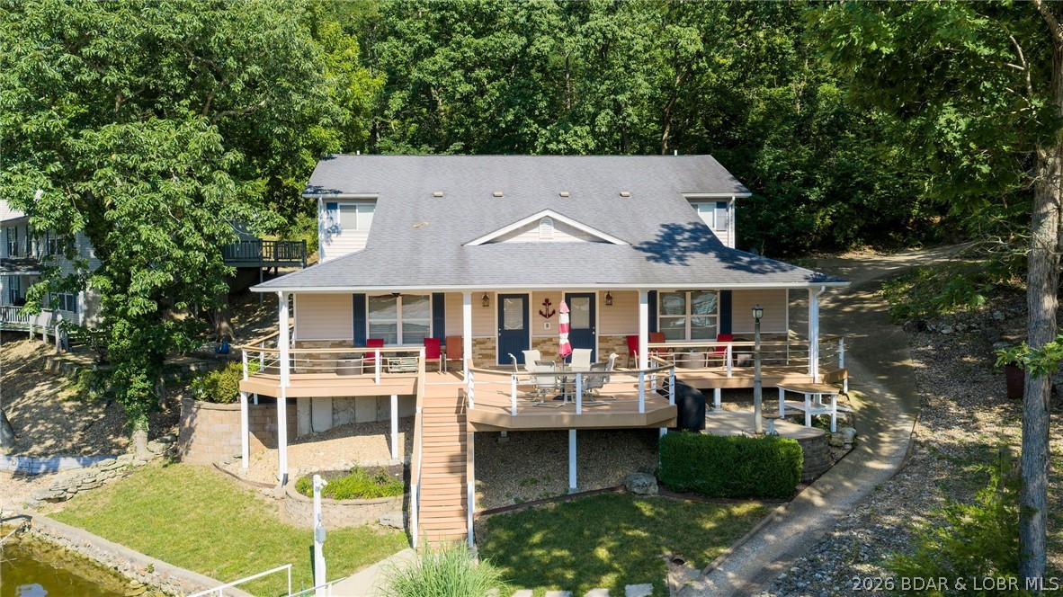 Designed with gathering in mind, this unique lake home was thoughtfully built to comfortably accommodate two families under one roof while still offering space and privacy for everyone. The functional floor plan features dual primary suites and two half baths on the main level, while the upper level offers two additional bedrooms, a loft, and plenty of room for guests.
Being sold fully furnished, this home is ready for you to start enjoying lake life from day one. Outside, you'll appreciate the private well and septic system (septic pumped approximately two years ago) and a fantastic waterfront setup. The 2-well dock includes two 11' x 24' boat slips, a 4,000-lb lift, and a 5,000-lb lift. Situated in a peaceful no-wake cove with approximately 10 feet of water even during the off-season, you'll enjoy excellent water depth for boating, swimming, and fishing throughout much of the year. Whether you're searching for a full-time residence, vacation retreat, or a place to create lasting memories with family and friends, this turnkey lake home is ready for its next chapter. Call for a private showing today!
