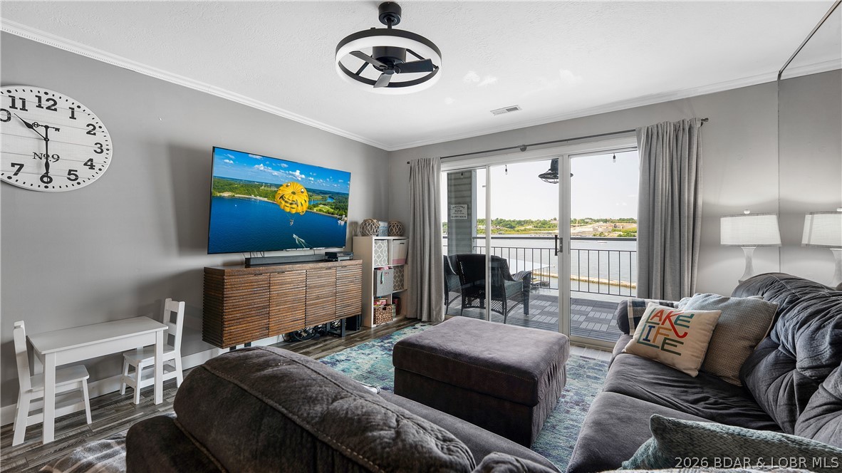 Discover the perfect blend of comfort, convenience & lake lifestyle in this beautifully updated, turnkey condo located in the heart of Osage Beach. Designed for effortless enjoyment, this fully furnished retreat comes complete with all the essentials, including a newer full-size washer & dryer, updated kitchen appliances, a pull-out sofa for additional sleeping space & thoughtful extras such as a kids’ table & bunk beds in both bedrooms. The spacious interior features durable laminate flooring throughout, a dedicated owner's storage closet & a welcoming layout ideal for full-time living, weekend getaways or a fantastic investment opportunity. Step outside onto the composite deck & take in the breathtaking panoramic views of the main channel. This condo also includes a coveted boat slip on Dock E, Slip 5, easy access to the lake! The community amenities are equally impressive, with the pool conveniently located next to the building, a clubhouse perfect for entertaining, all while surrounded by incredible lake views. Located just minutes from shopping, dining & entertainment, you’re only a short boat ride away from popular destinations, Shootout & peaceful beauty of the State Park.