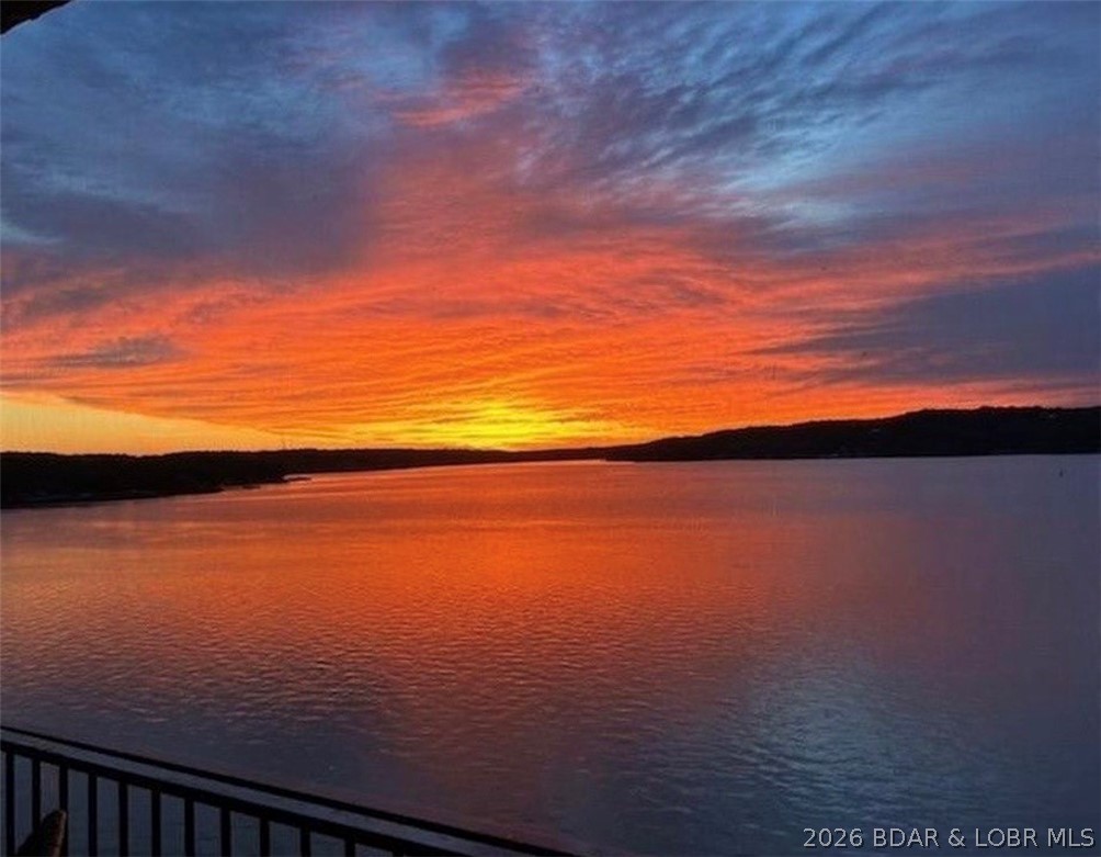 Where dreams become realty, this 1999 sq. ft. Tuscan Style corner unit, finished in 2014, comes complete with furnishings and decor. Located at the 31 MM with incredible views and nearby waterfront restaurants, this condo includes 3 bedrooms(2masters), 3 full baths, expansive screened in deck, private secured parking garage, elevator from garage to your unit as well as convenience of no steps to dock. The unit features an open floor plan perfect for entertaining guests. Upgrades includes: custom wainscot panels, 2 custom tiled showers, plantation shutters throughout, granite kitchen counter tops, SS appliances, jacuzzi tub, electric fireplace, & Laundry room. Complex features paved roads to guest parking and to front door, and lakefront swimming pool w/kitchen area and restroom, a handicap ramp to the boat dock that accommodates a wagon, walker, or wheelchair. Complemented by a 16x40 boat slip with wave breaks and a reserved parking in garage along with a shared large ice machine for your cooler. Yearly rentals only. Additional parking space and PWC slip for additional cost. Discover unmatched privacy and tranquility at this quaint 20 unit Bella Sera Condo complex.