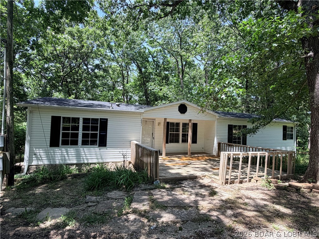 Come check out this refreshed 3-bedroom, 2-bath manufactured home with a BRAND NEW ROOF! She is PRICED TO SELL and offers space and convenience—just minutes from the lake. Step inside to discover fresh paint, brand-new flooring, updated fixtures, and new kitchen countertops, creating a bright, clean, and truly move-in ready space. Outside, the property really shines with a spacious shop with electric—ideal for hobbies, storage, or tackling projects of any size. Whether you’re unwinding indoors or putting the extra workspace to good use, this home offers the flexibility to fit your lifestyle. With its thoughtful updates, small acreage, and prime location near the lake, this inviting property is ready to welcome you home. Property is being sold AS-IS.