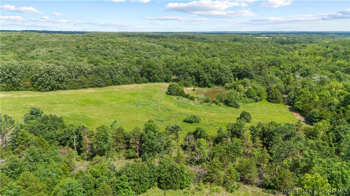 Tucked away just 4/10 of a mile off Highway 52 and situated near Big Rock Road directly behind the church, this exceptional 29.48-acre property offers the perfect blend of accessibility, privacy, and freedom. A newly constructed access road leads you into an expansive, picturesque landscape featuring lots of lush, rolling pasture land that makes it absolutely ideal for a hobby farm. The property boasts a highly desirable level-to-moderate terrain, completely ready for your vision, and comes beautifully enhanced by two serene ponds perfect for livestock, fishing, or simply enjoying the view. Best of all, there is no HOA to restrict your plans, giving you complete control over your estate to build, farm, or expand as you wish. Here, you can enjoy the peace, quiet, and self-sustainability of a secluded rural setting while remaining just a convenient 10-minute drive from the heart of Eldon.