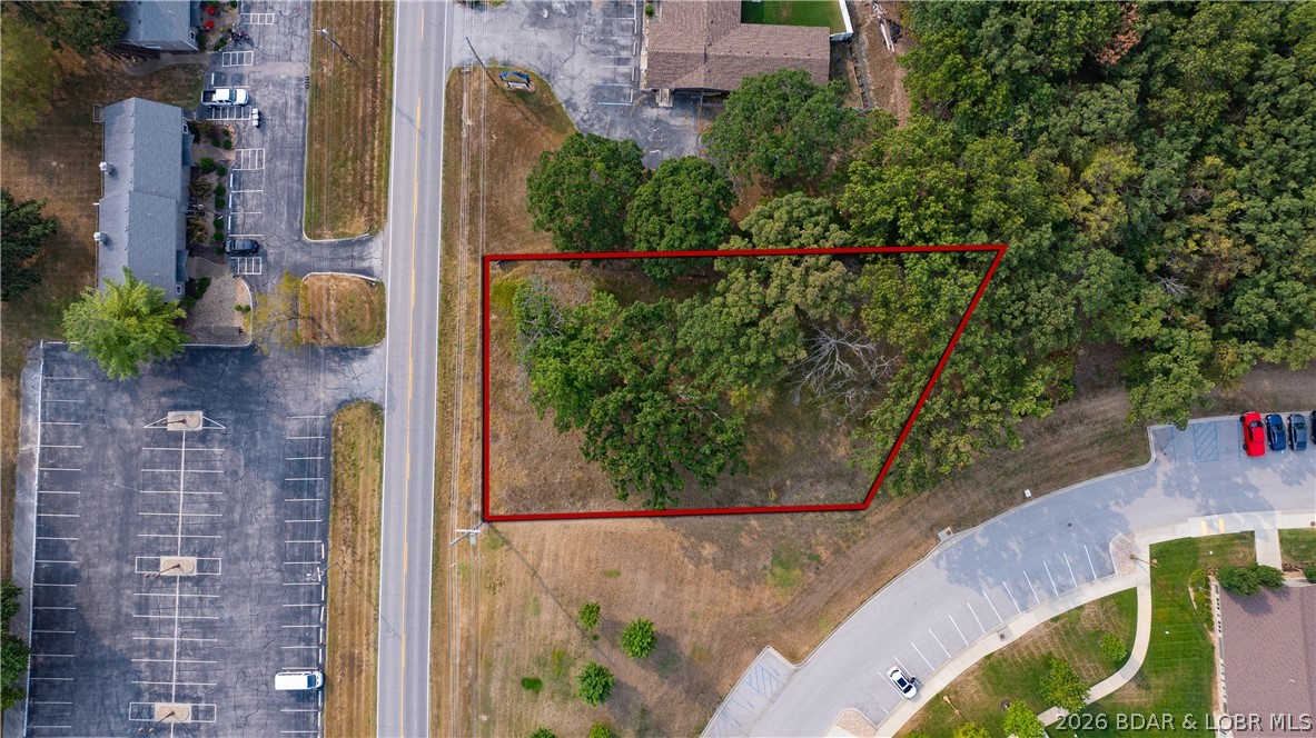 xceptional commercial opportunity in a high-growth corridor! This C-1 zoned property offers over 110 feet of prime Highway KK frontage, with a MODOT-approved entrance plus secondary access for excellent visibility and easy customer flow. Sitting on just over half an acre, it includes city water, sewer, and electric—ready for development. Located in the heart of Osage Beach near Lake of the Ozarks, this site is surrounded by established neighborhoods, condos, and marinas. Positioned across from Jeffries Fine Dining and next to KK Jewelers, it benefits from steady traffic and strong local activity. Just minutes from the Hwy 54/KK overpass and close to Margaritaville Lake Resort Lake of the Ozarks, golf courses, and popular attractions, this location stays busy year-round. Flexible C-1 zoning supports retail, dining, office, or entertainment. A prime opportunity to build in one of the lake’s most desirable commercial areas.