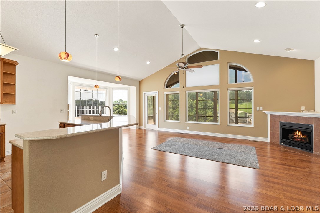 Stunning 4BR/3BA villa (2,600 sq ft) at the Villas at Grand Glaize in the heart of Osage Beach at the Lake of the Ozarks! Close to the community pool, this home offers effortless main-level living and a bright, open floor plan. The main level hosts 2 bedrooms and 2 full baths, including a primary bedroom with en suite bath and a huge walk-in closet with attached laundry room that opens to the kitchen-so convenient! The beautiful kitchen features honey maple cabinets, new countertops, and new appliances (2024-2025). Relax in the upper 3-seasons screened room or head downstairs. The walk-out lower level is perfect for guests, boasting a family room, 2 bedrooms, a full bath, utility room with a second W/D, sink hookups, an entertainment bar area and lower open deck. There is also a detached, heated, and insulated "man cave" garage available for additional $, featuring a custom back-end saloon/bar area and a walk-up loft with a built-in hoist for easy storage. Updates include a new roof (2024), an 8-year-old HVAC, and a Lindy Spring water softener (2022). Attached 2-car garage. Golf cart community-Golf cart also available. Turn your Dreams to Reality—Call Today!