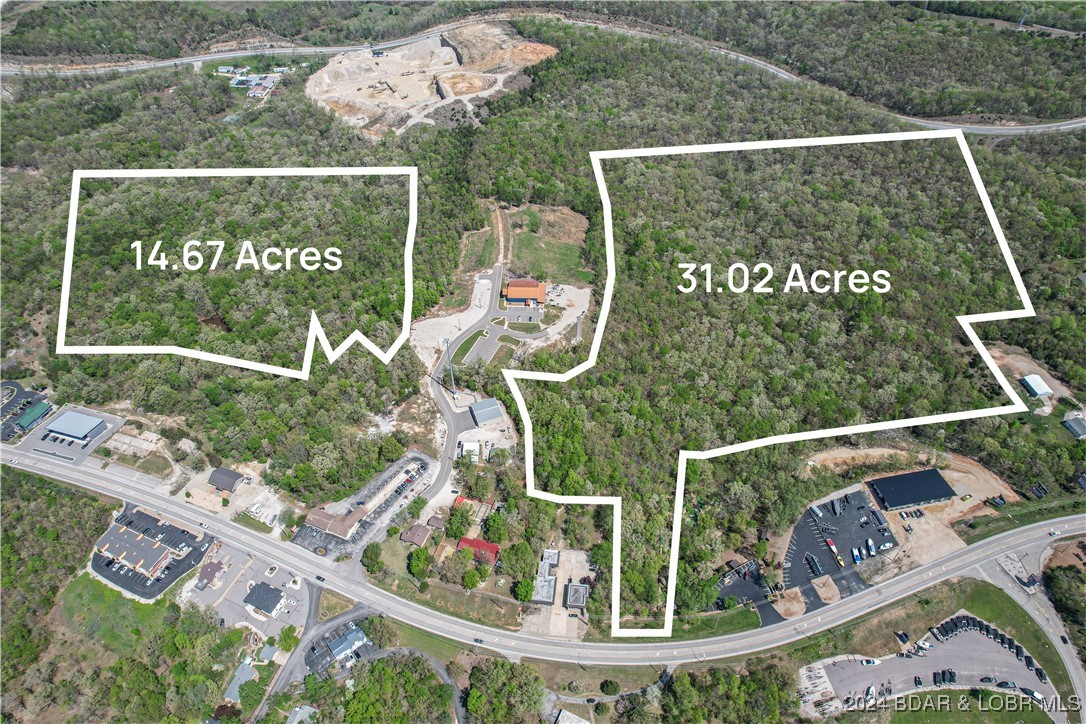 Approximately 31 acres, with C-2 zoning (general commercial) centrally located in Lake Ozark with several access points including a portion with Business 54 frontage. Property has varying topography but there are some large gentle portions of the property that would be very easy to develop. Tons of new activity in the area including a beautiful winery that has become a hit in the area! This property is in a Tif district that has already been approved as a commercial project area. Tif can be a great investment tool for developers so feel free to reach out with questions. It appears Lake Ozark could be on the preface of some great opportunity. Own a big chunk of the limited ground inside the city limits at an affordable price!