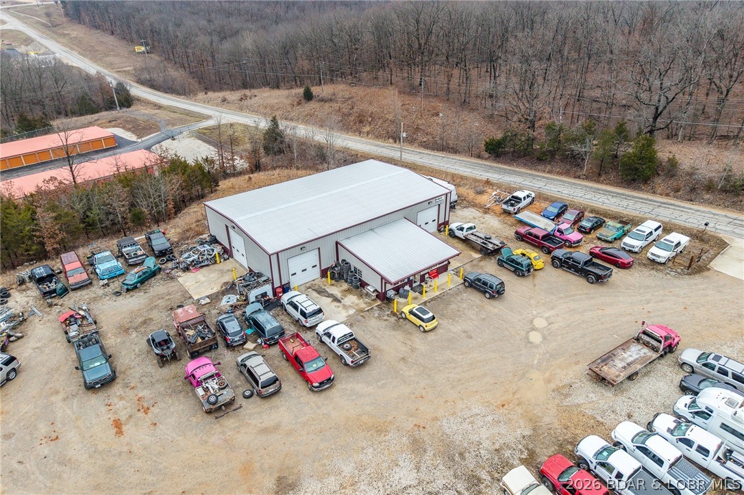 ZONED B-2 is this 24.17 acres that adjoins the Ozarks amphitheater with a 50x80 shop that has a 24x30 office. shop building offers   Mini split in office and central HVAC in shop building, all metal framing and 4- 12x14 overhead doors. Very versatile property fronting old HWY 5 with easy access to new Hwy 5.  Not many properties this close to town zoned B-2 available with this kind of opportunity. Shop is currently rented and bringing in $3250 a month. Many different business ventures could thrive here!
PROPERTY CAN BE SPLIT UP-SHOP AND 4 ACRES CAN BE BOUGHT SEPERATE.