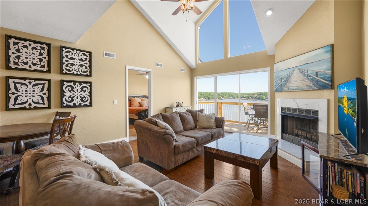 Experience breathtaking panoramic main channel views from this top-floor condo at The Ledges in the heart of Osage Beach. This fully turnkey opportunity includes a proven rental history, a 14x40 boat slip, and a PWC slip—offering the perfect blend of lake lifestyle and investment potential. Located in Building 9, this updated unit features vaulted ceilings, an expansive wall of windows, a brand-new deck, and spacious living areas designed for relaxing and entertaining. The oversized loft-style third bedroom offers incredible flexibility for additional guests and sleeping space, while the lakeside primary suite features private deck access, stunning views, a walk-in closet, and double vanity sinks.  The Ledges offers resort-style amenities including two pools, a swimming beach, and an unbeatable 21MM location with quick access to waterfront restaurants, shopping, entertainment, and more by land or water. Whether you’re searching for a lakefront getaway, full-time retreat, or investment property, this condo checks all the boxes with top-floor privacy, incredible views, a sought-after dock package, and one of the best locations at Lake of the Ozarks.